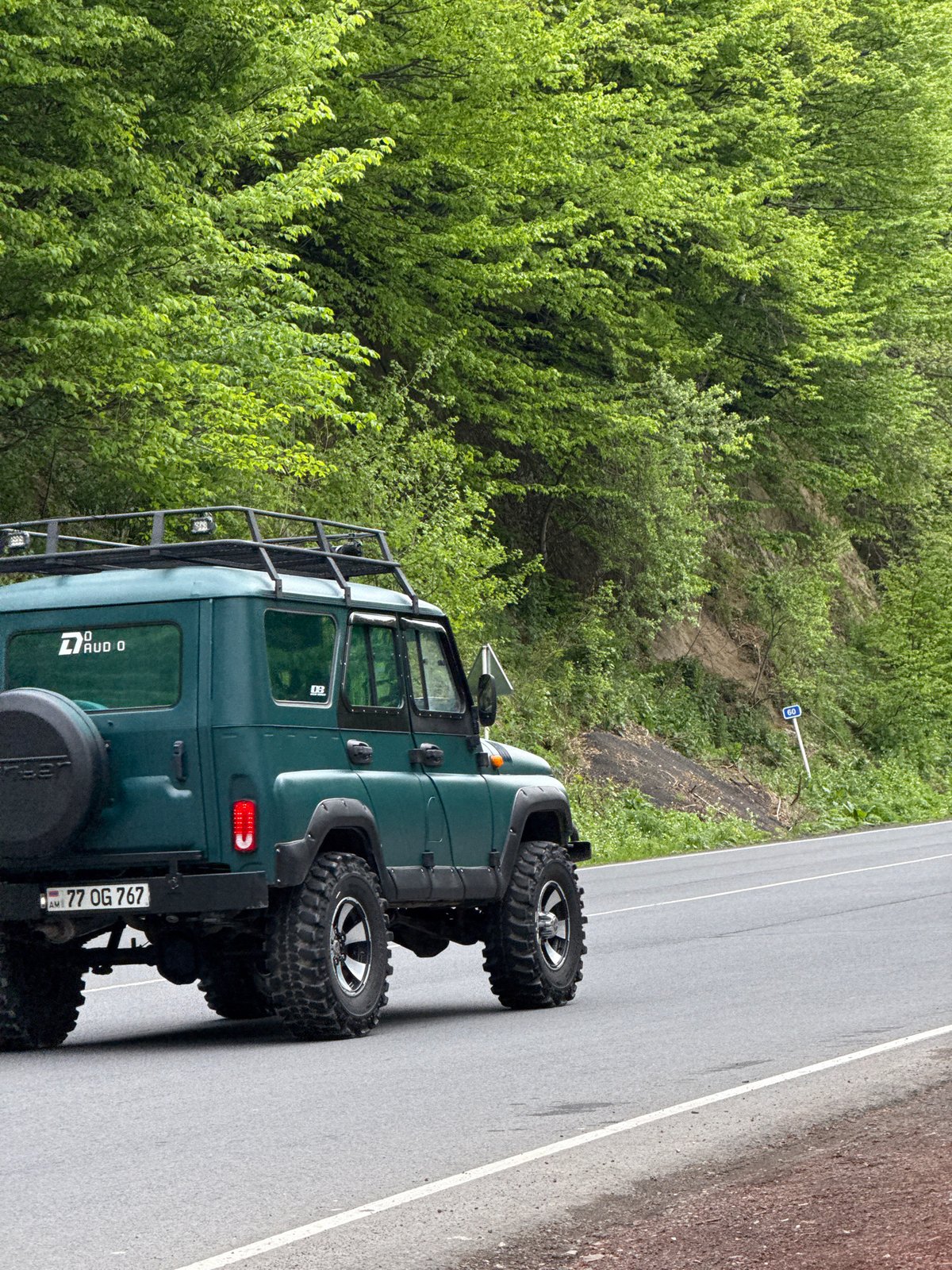 Ordinary moments captured in Dilijan: parked jeep, man eating corn