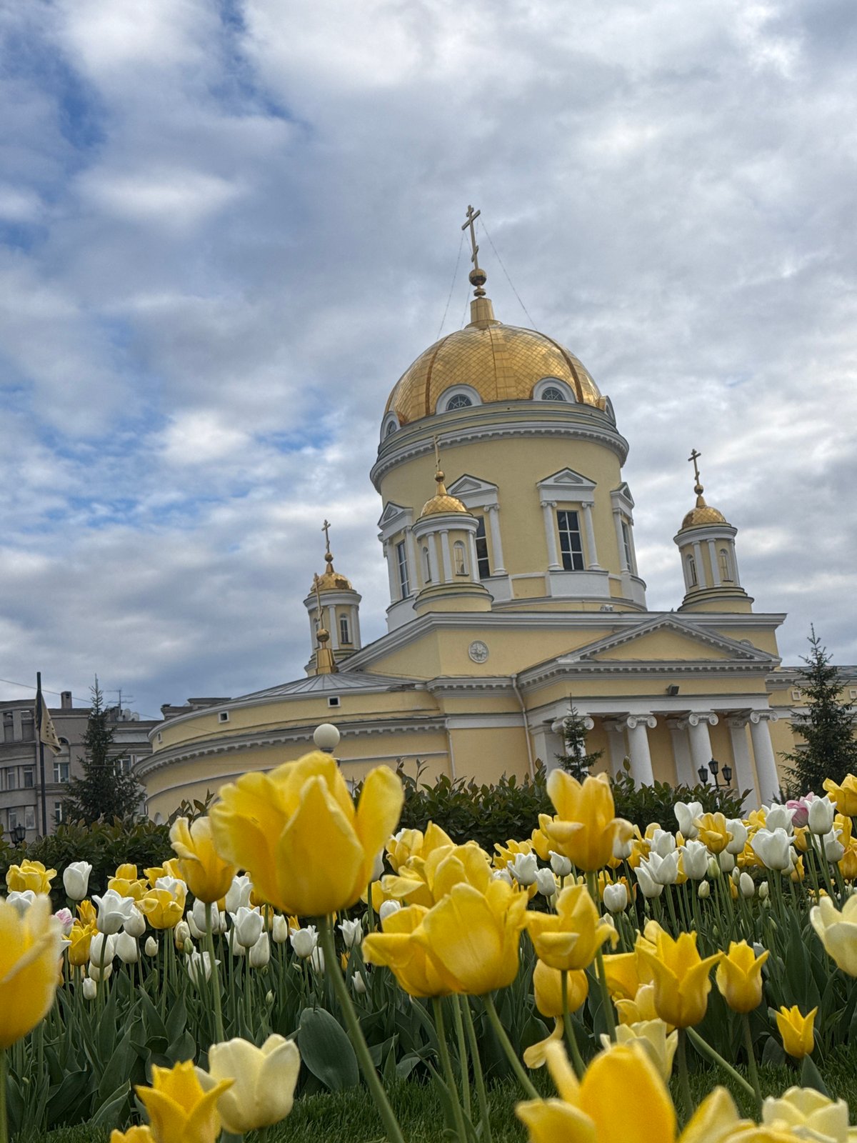 Spring tulips frame historic Church on Blood in Yekaterinburg