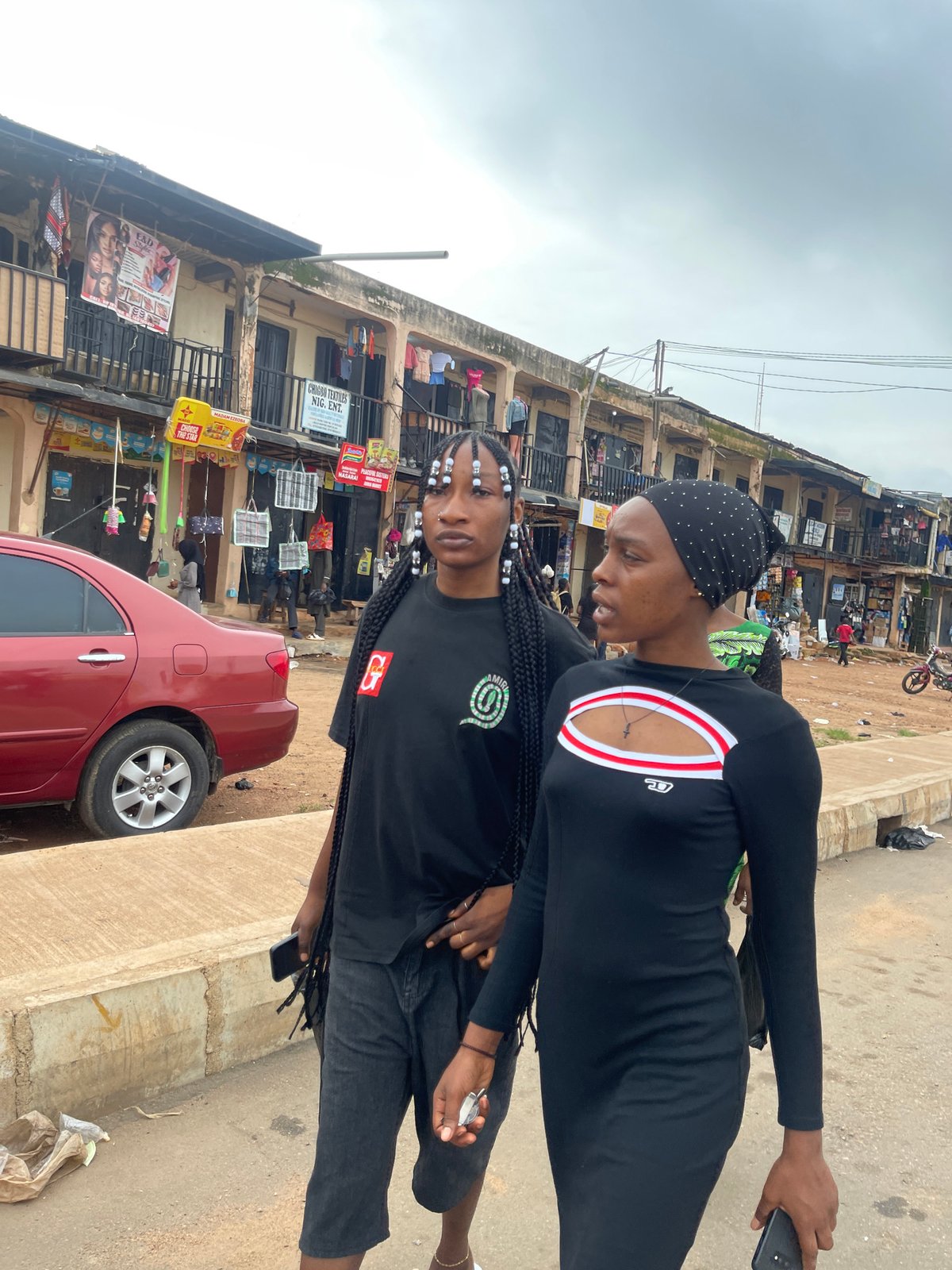 Midday street life in a busy Jos commercial district