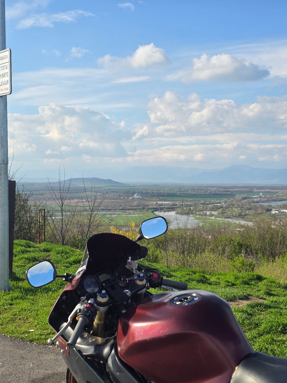 Motorcyclist documents Bulgarian flags, scenic views at Yambol memorial overlook