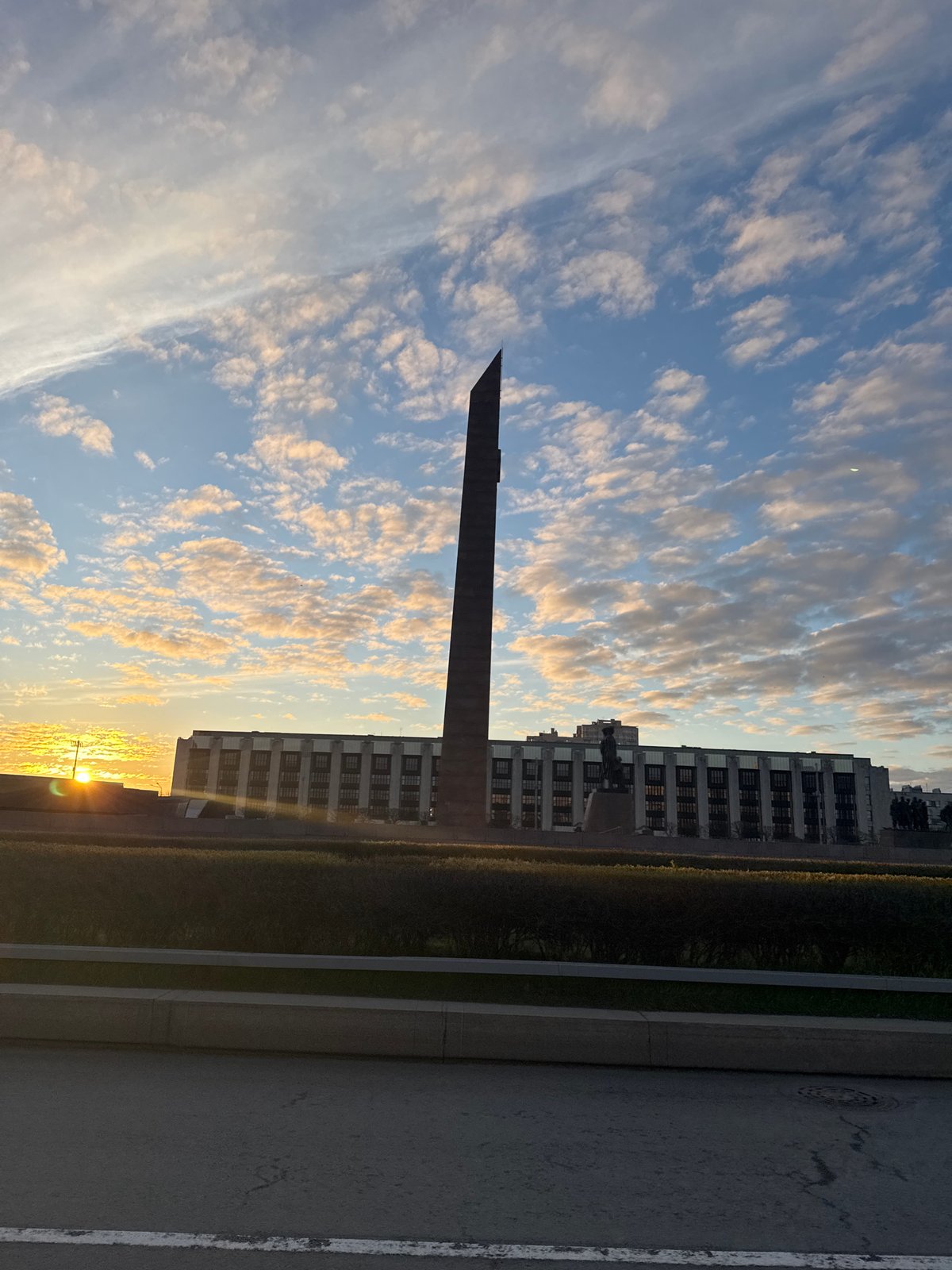Tall monument photographed against Saint Petersburg skyline early morning