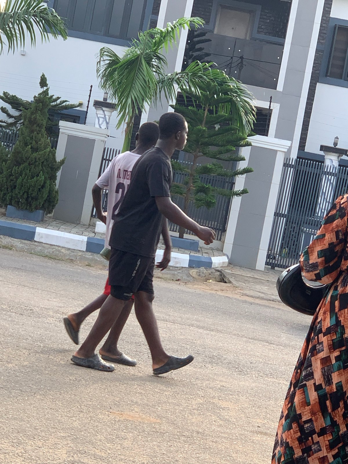 Afternoon street life in a residential Abuja neighborhood
