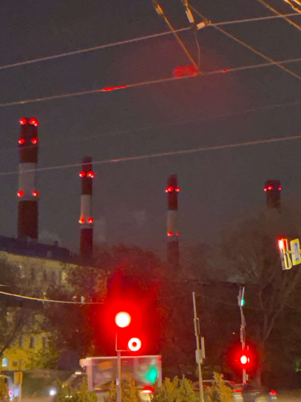 Moscow railroad crossing active at night near illuminated building