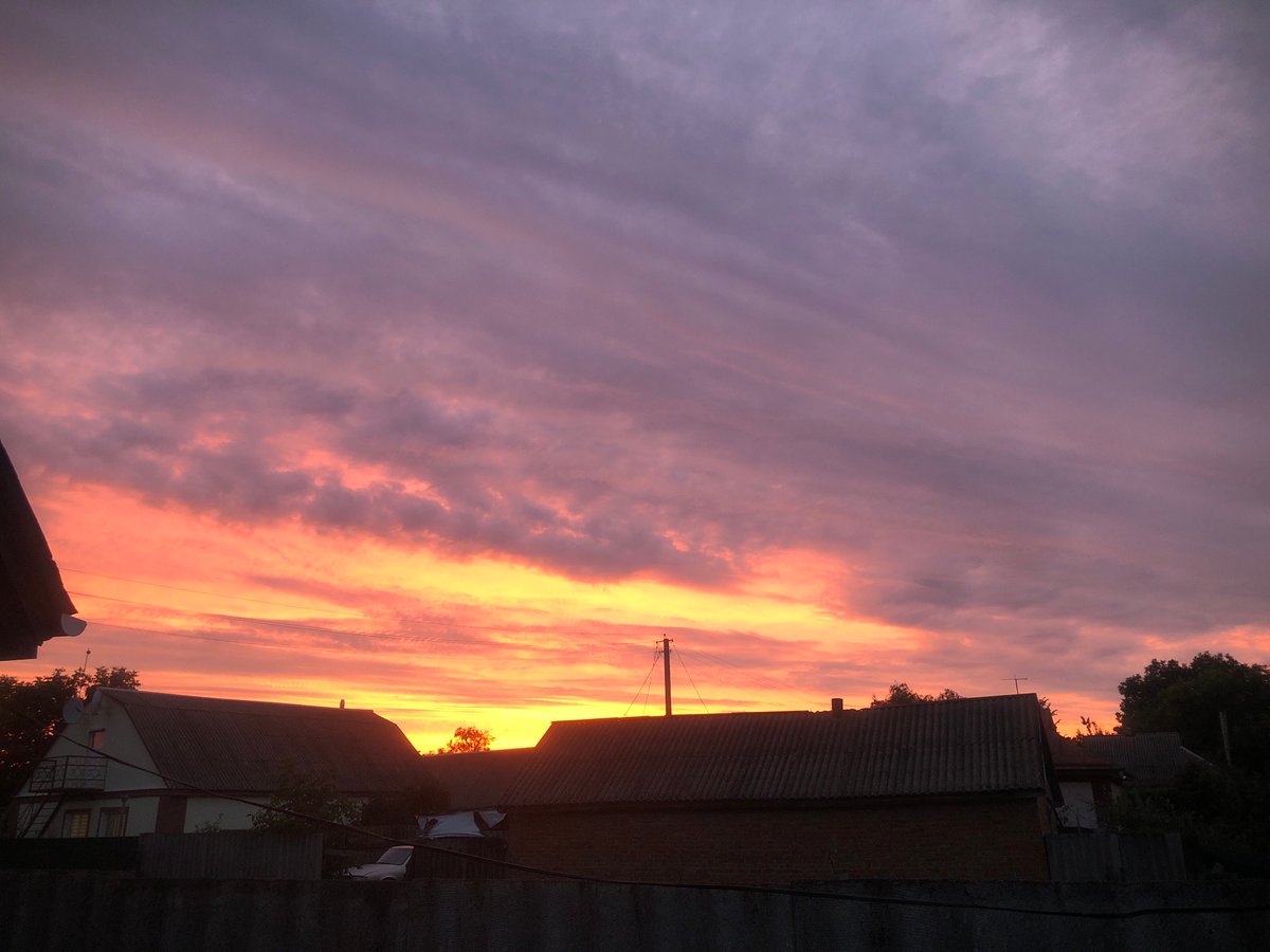 Sunset sky shifting through orange, pink, and purple