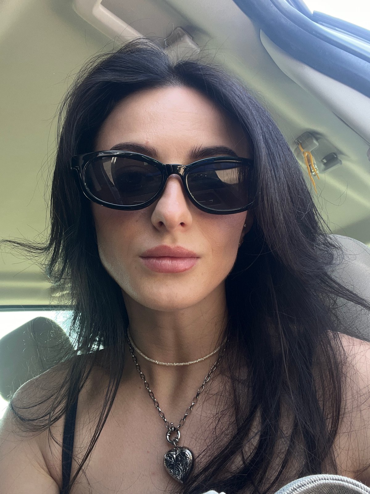 Sunglasses selfie from inside a car in Lviv