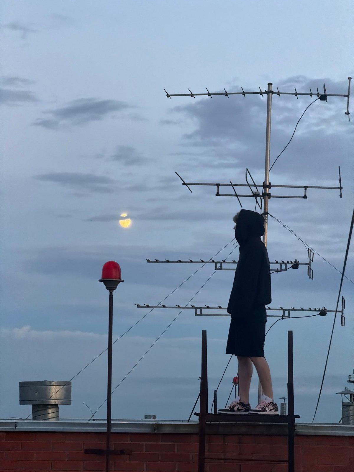 Rooftop evening in Khimki: moonlight, strawberries, and city views