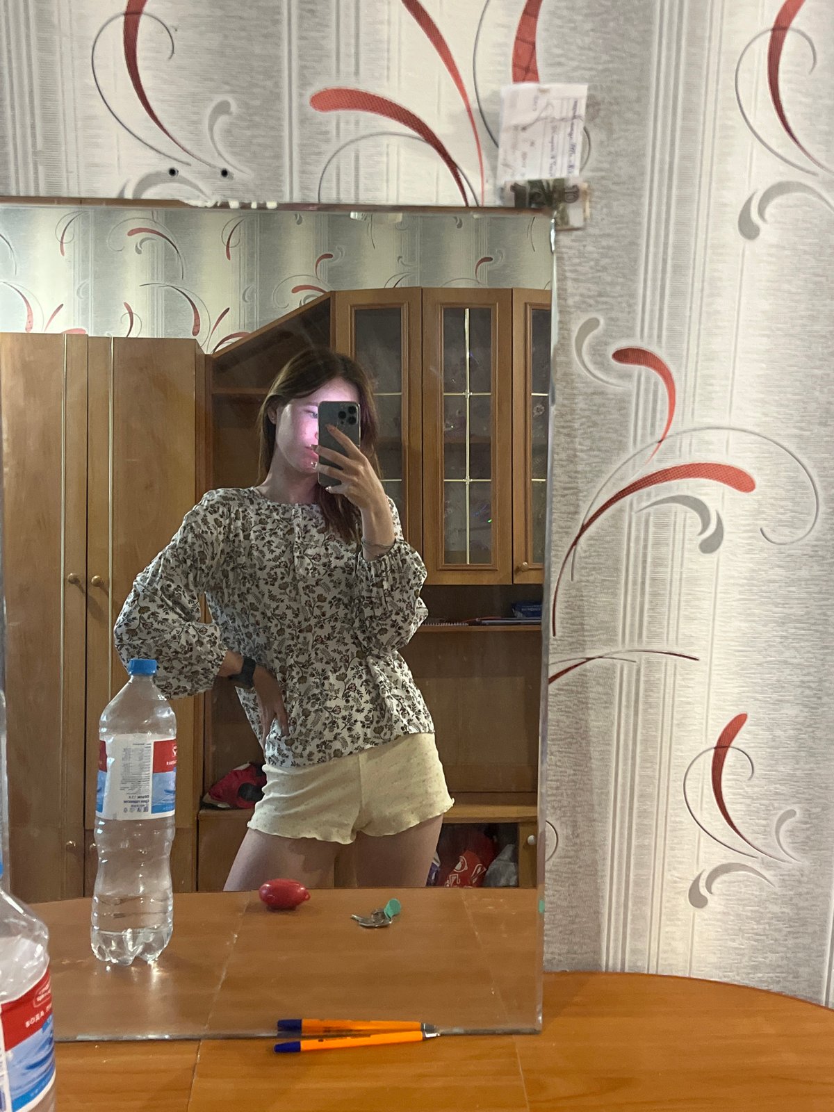 Woman takes morning selfies in bedroom and bathroom