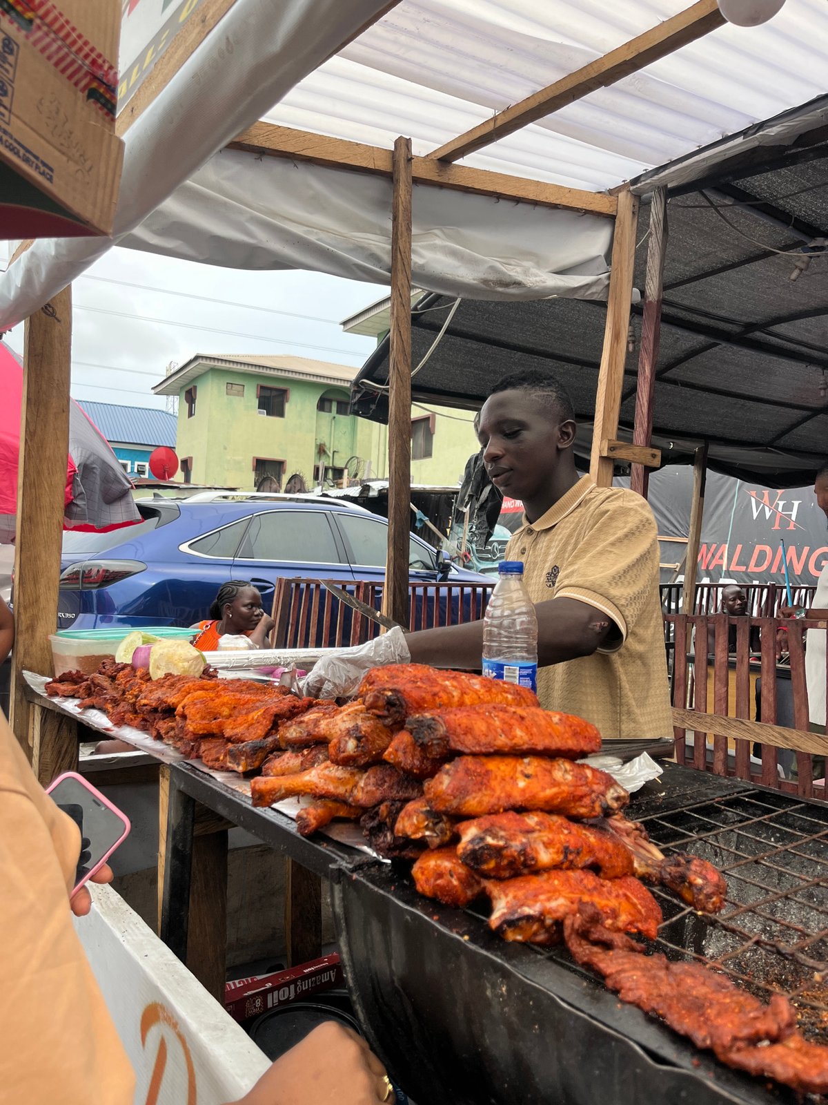Street food vendors serve customers in Ado, Nigeria