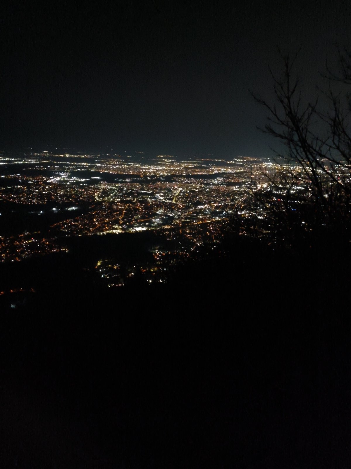 Nighttime aerial views capture illuminated Sofia cityscape