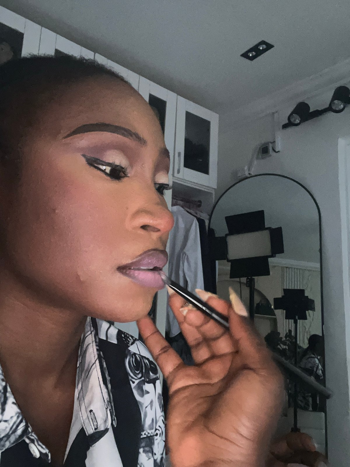 Chill afternoon in Abuja: makeup, selfies, and a white dog