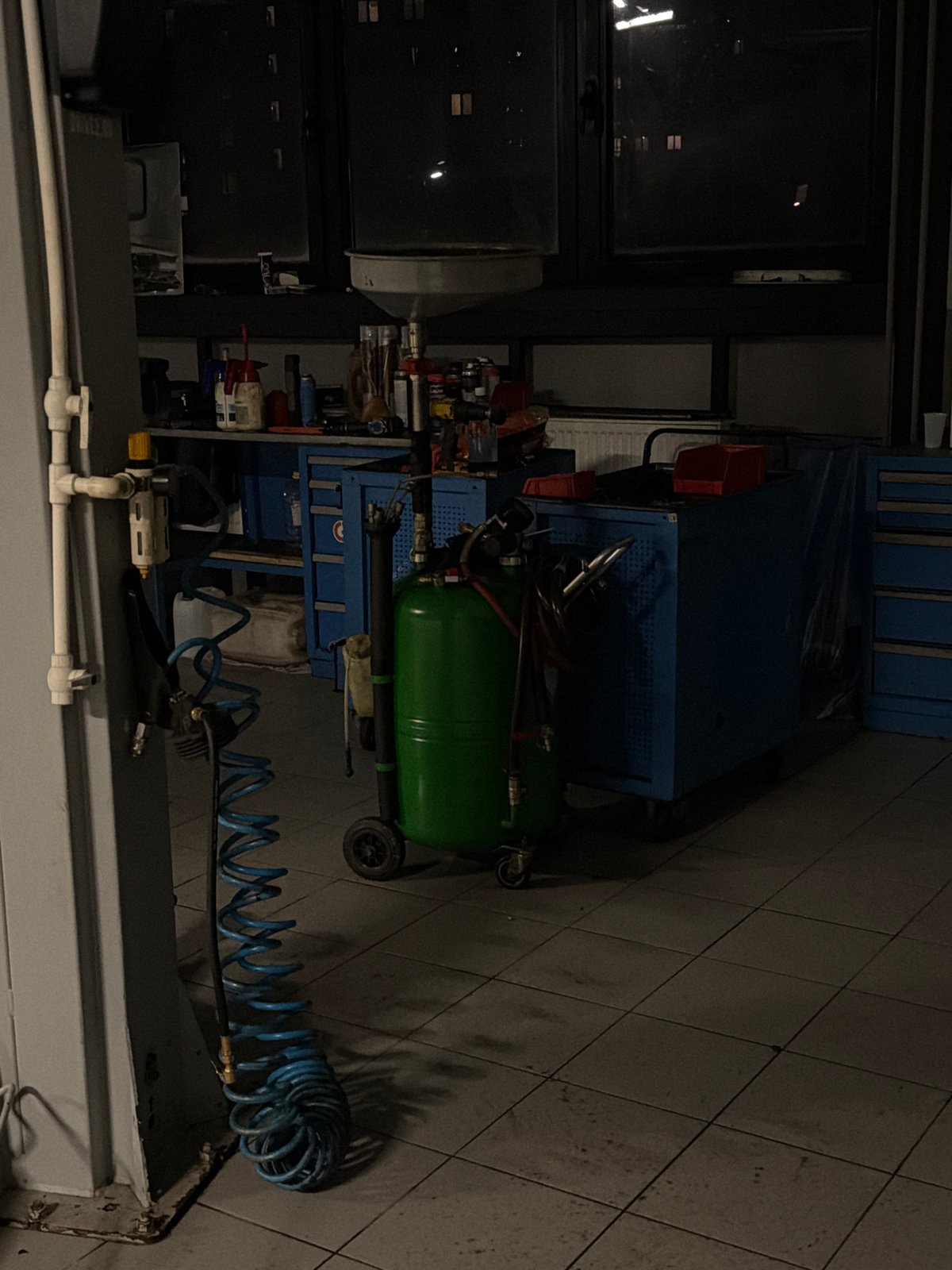 Garage workshop with tools and motorcycle documented in Izhevsk