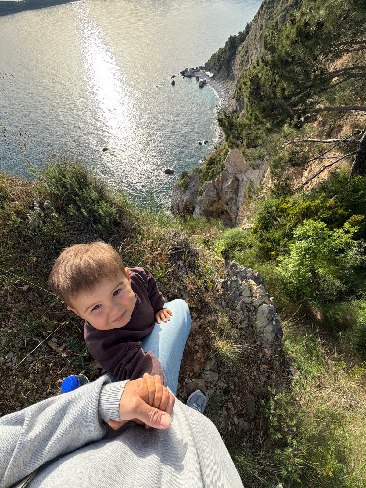 Person and child spotted at cliff near Budva, Montenegro