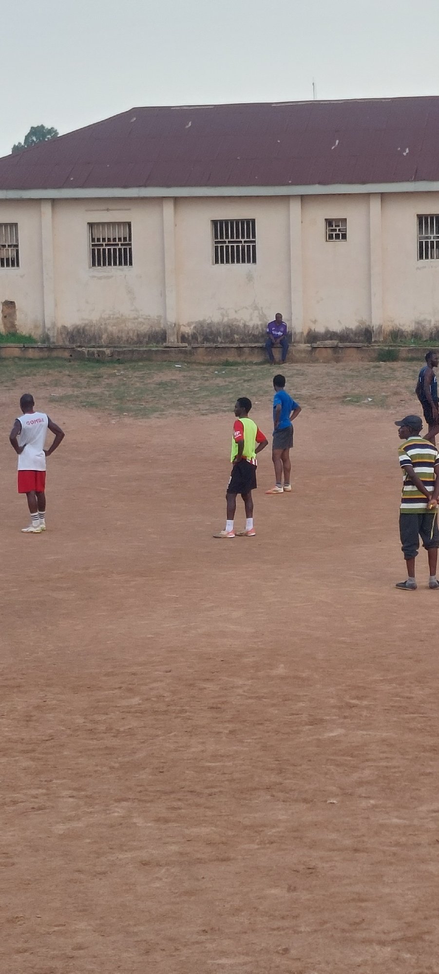 Soccer on a dusty pitch at Bukuru Stadium, Nigeria