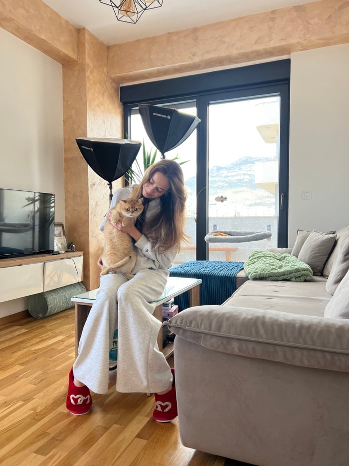 Woman and cat observed in Bar apartment morning scene