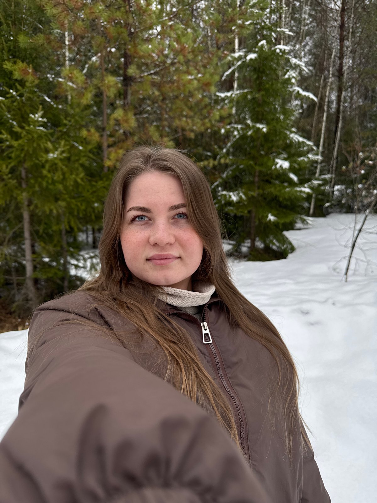 Woman takes winter selfies in snowy Russian village