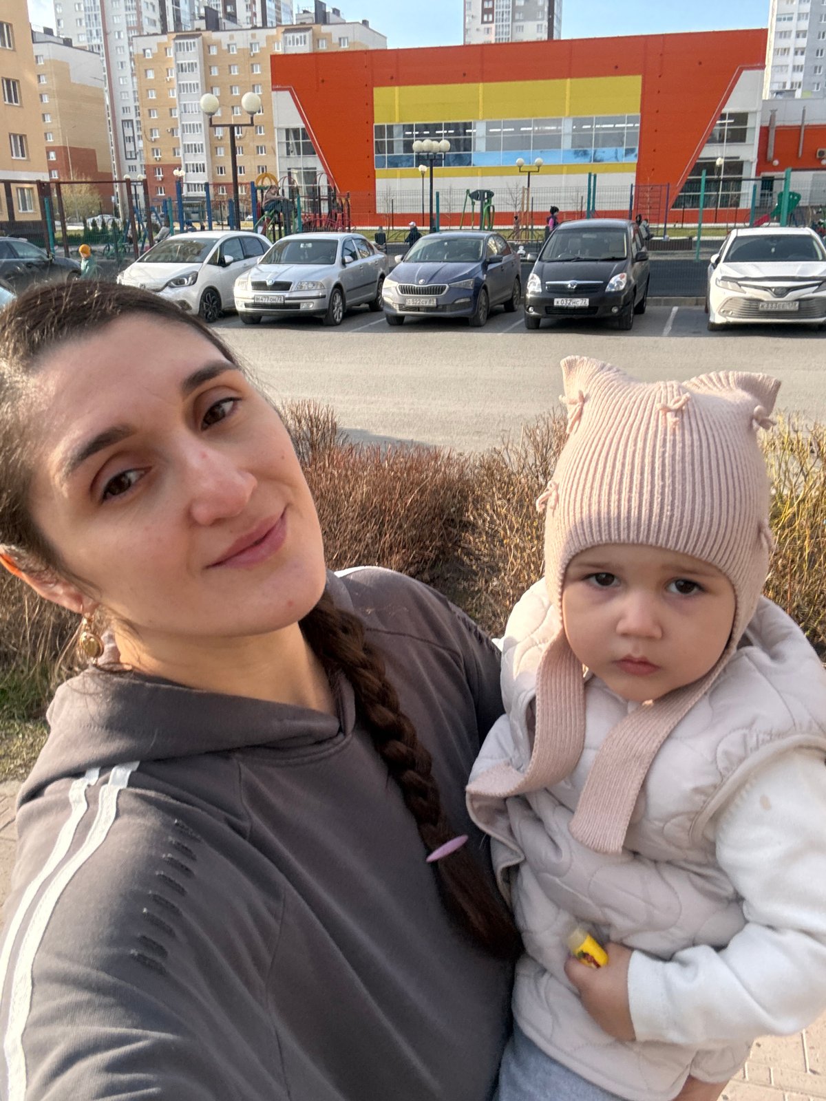 Woman photographed with baby in sunny Tobolsk