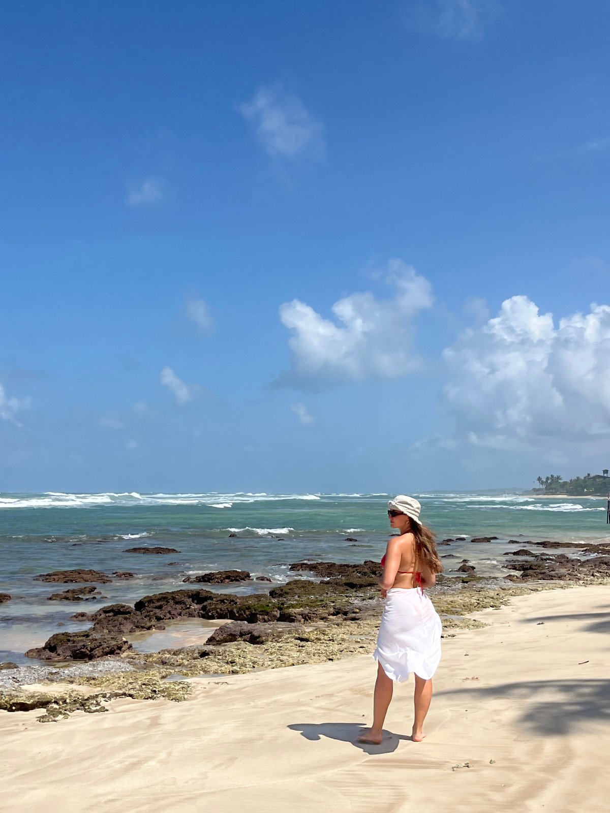 Exploring a tropical Sri Lankan beach on a sunny morning