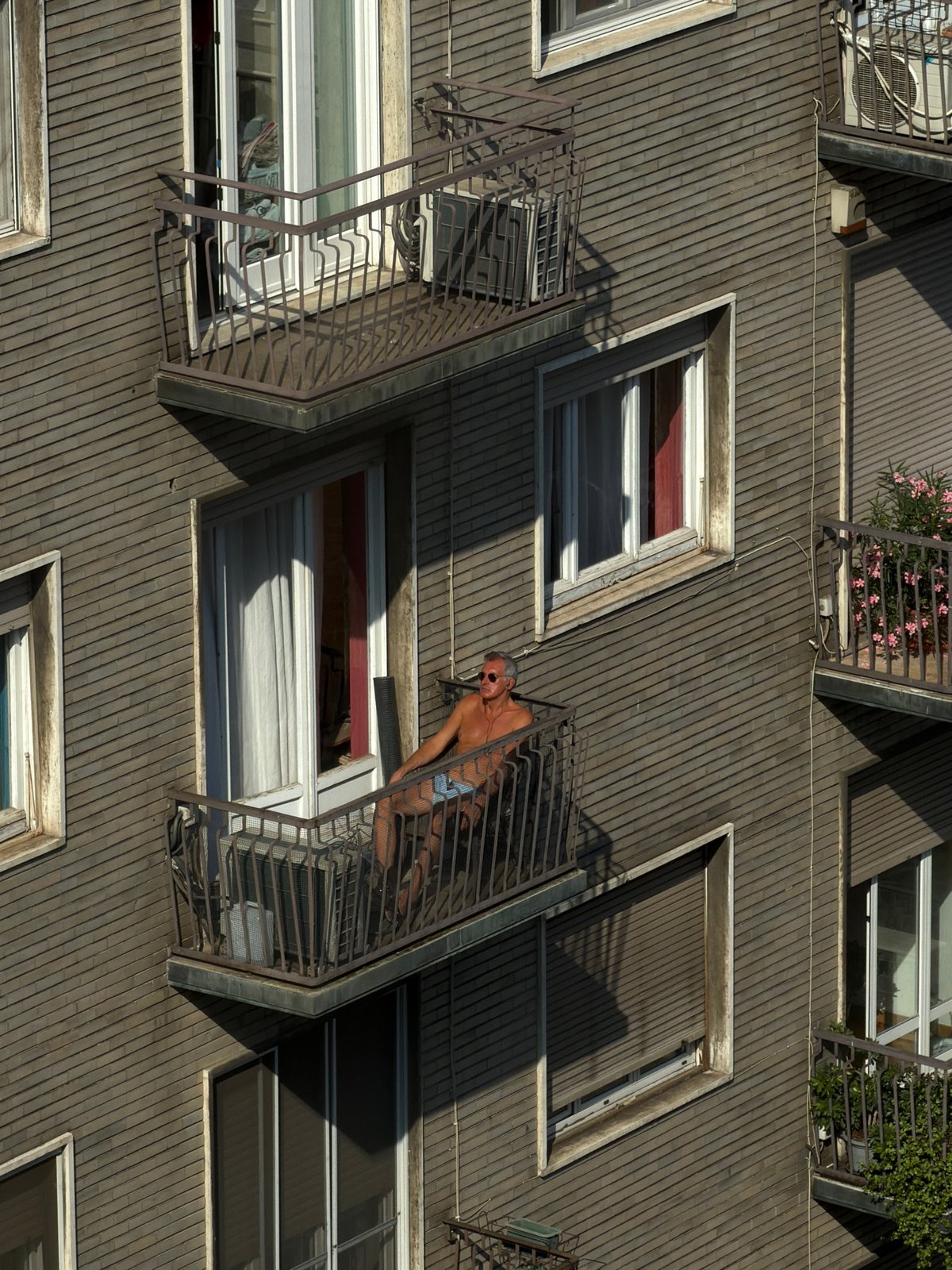 Milan building exterior, ground and aerial angles, June 2026