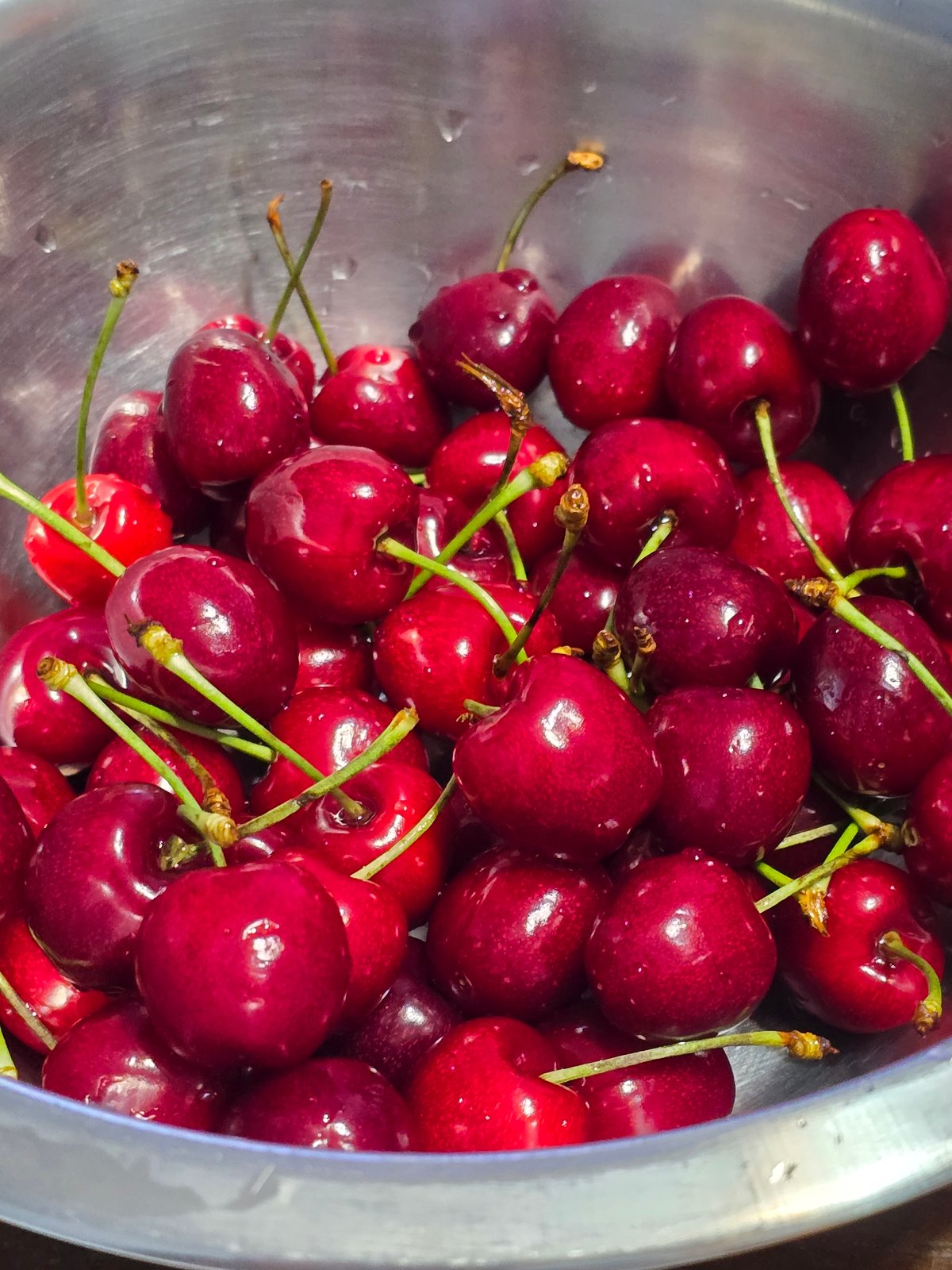 Fresh cherries photographed in metallic bowl in Sofia