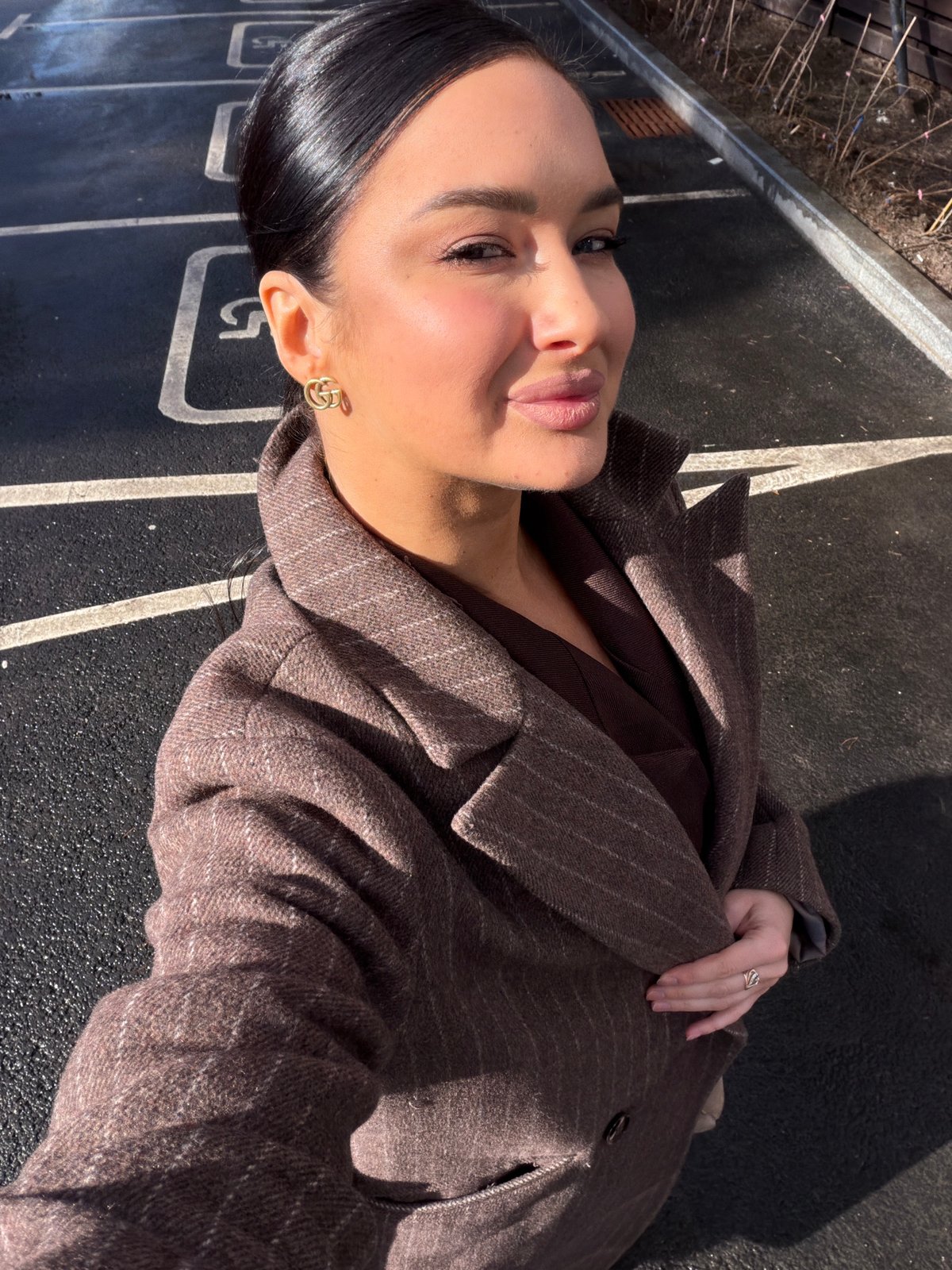 Woman in brown jacket photographed outdoors in Zhukovka, Russia