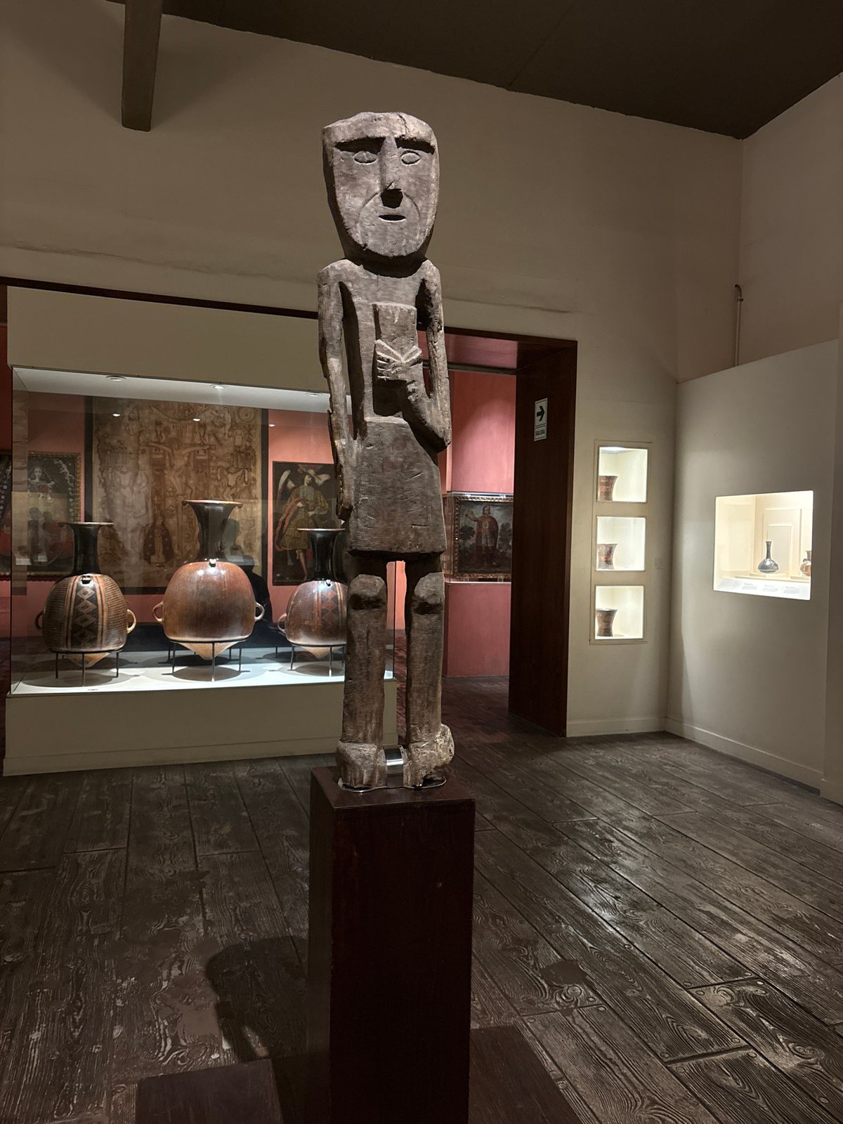 Museum visitor documents ancient Peruvian artifacts in Pueblo Libre