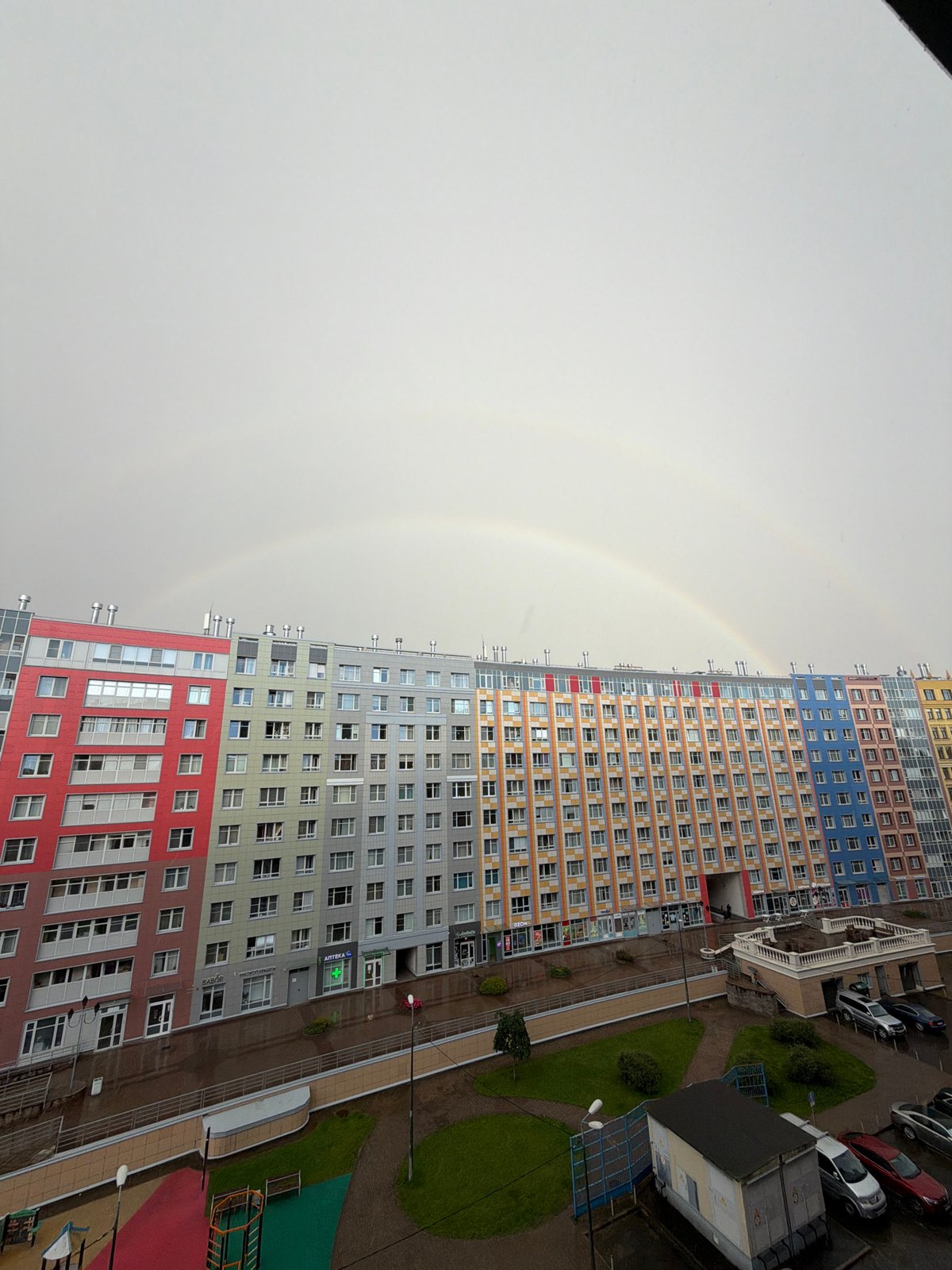 Double rainbow over Saint Petersburg's multi-colored apartment complex