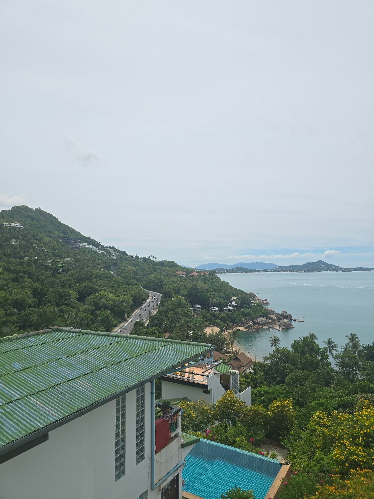Aerial views of a tropical coastal villa and surrounding coastline