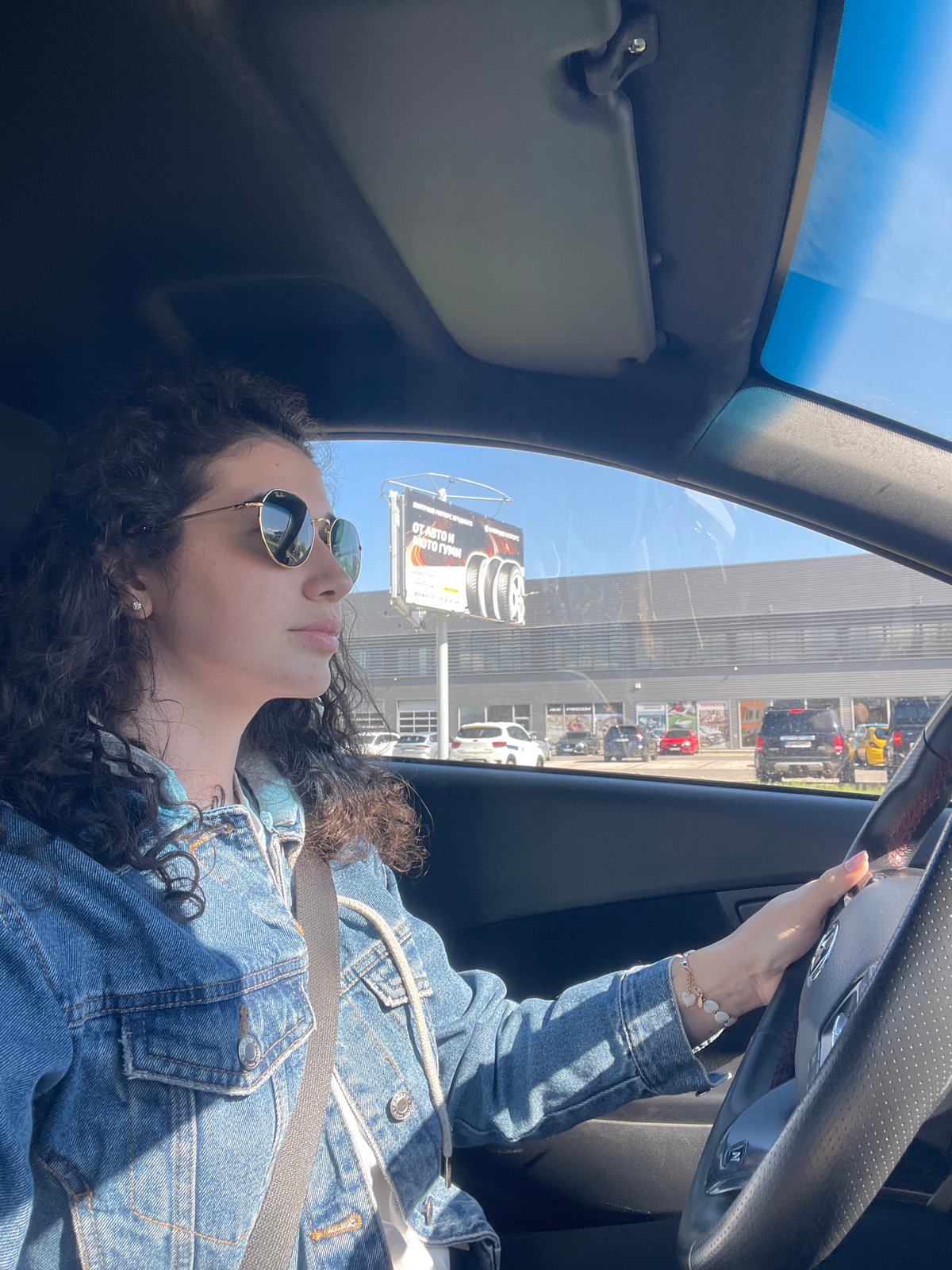 Woman drives highway near Sofia under clear skies