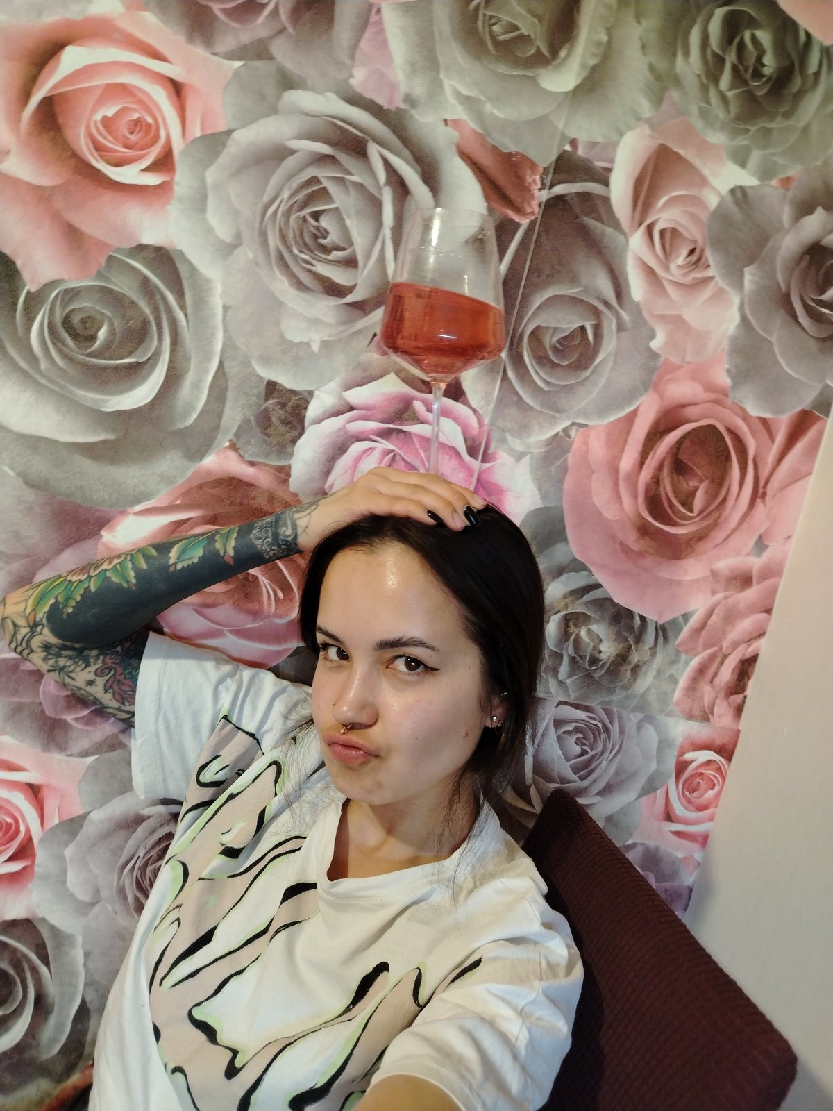 Woman documents wine gathering with food in Noviy, Russia