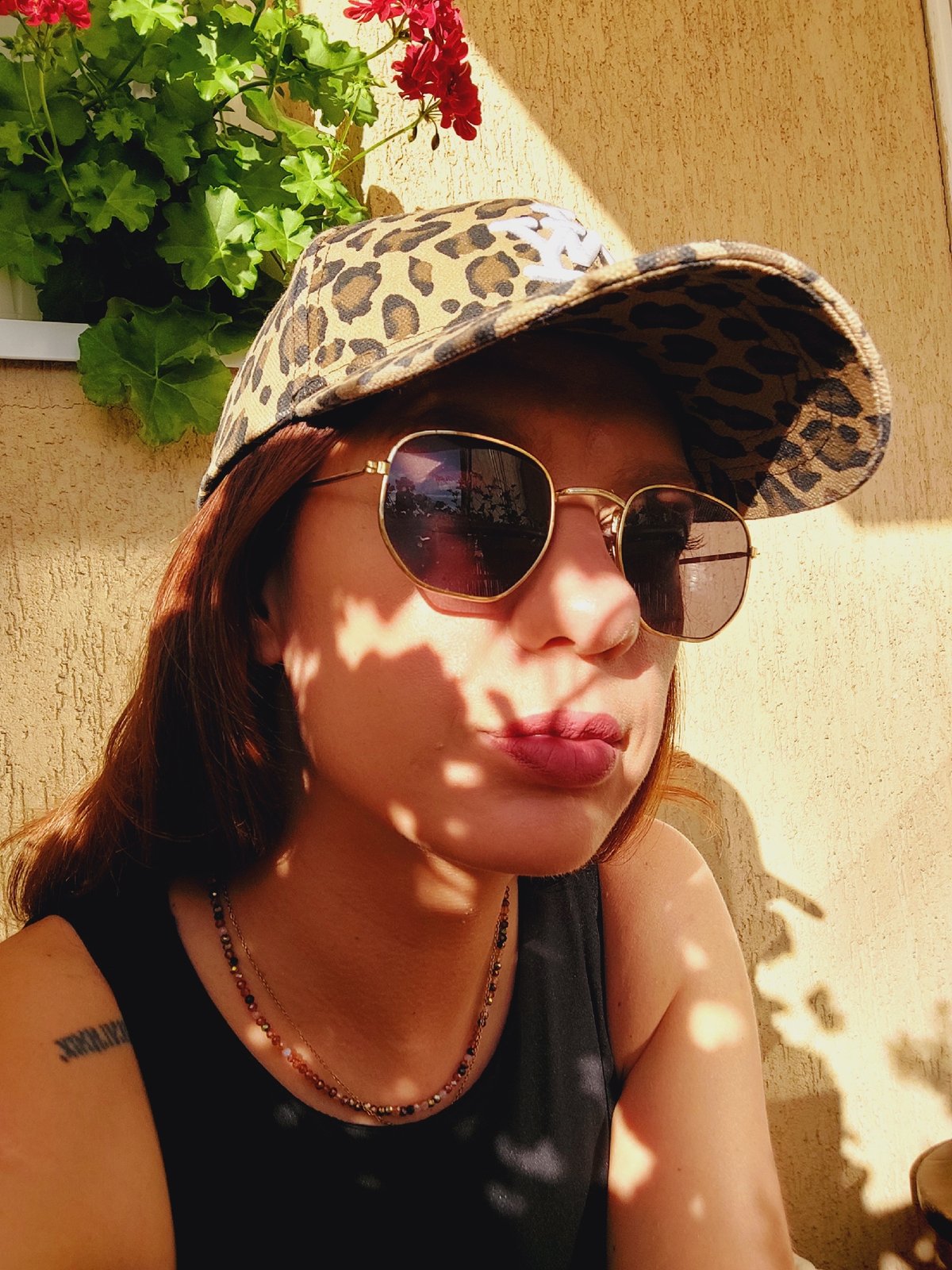 Balcony selfies and geraniums under a Sofia summer sky