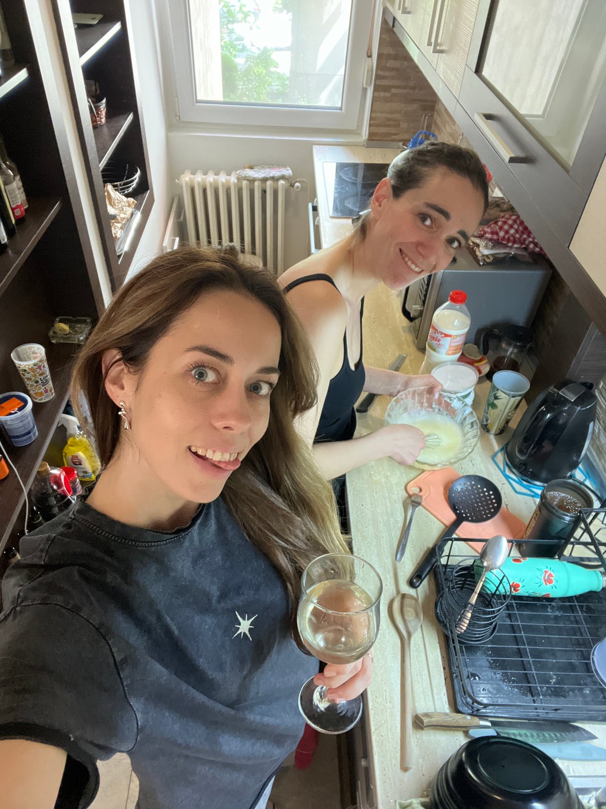 Women cooking and socializing in Belgrade area kitchen