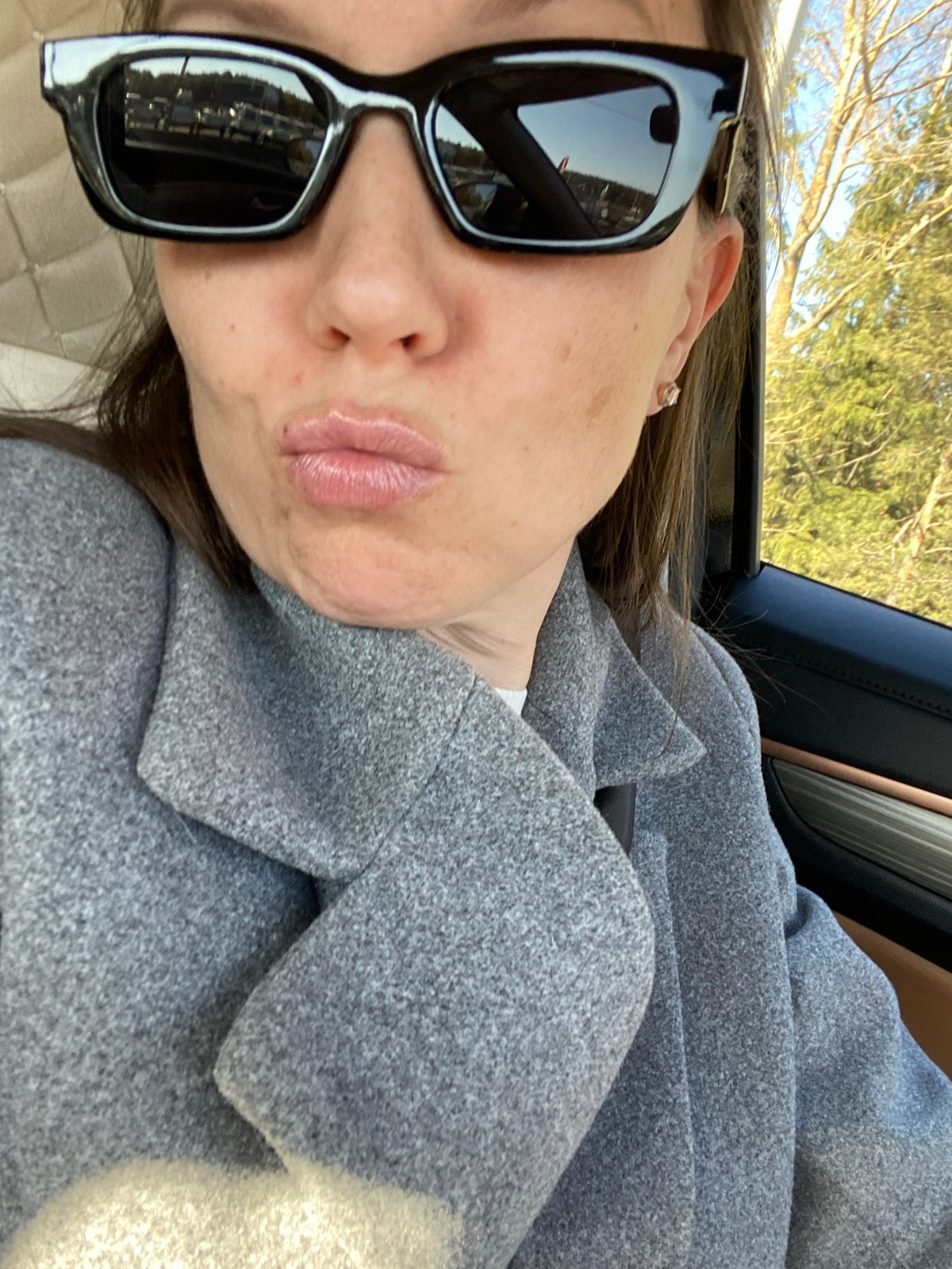 Woman in sunglasses spotted in car in Chaikovsky