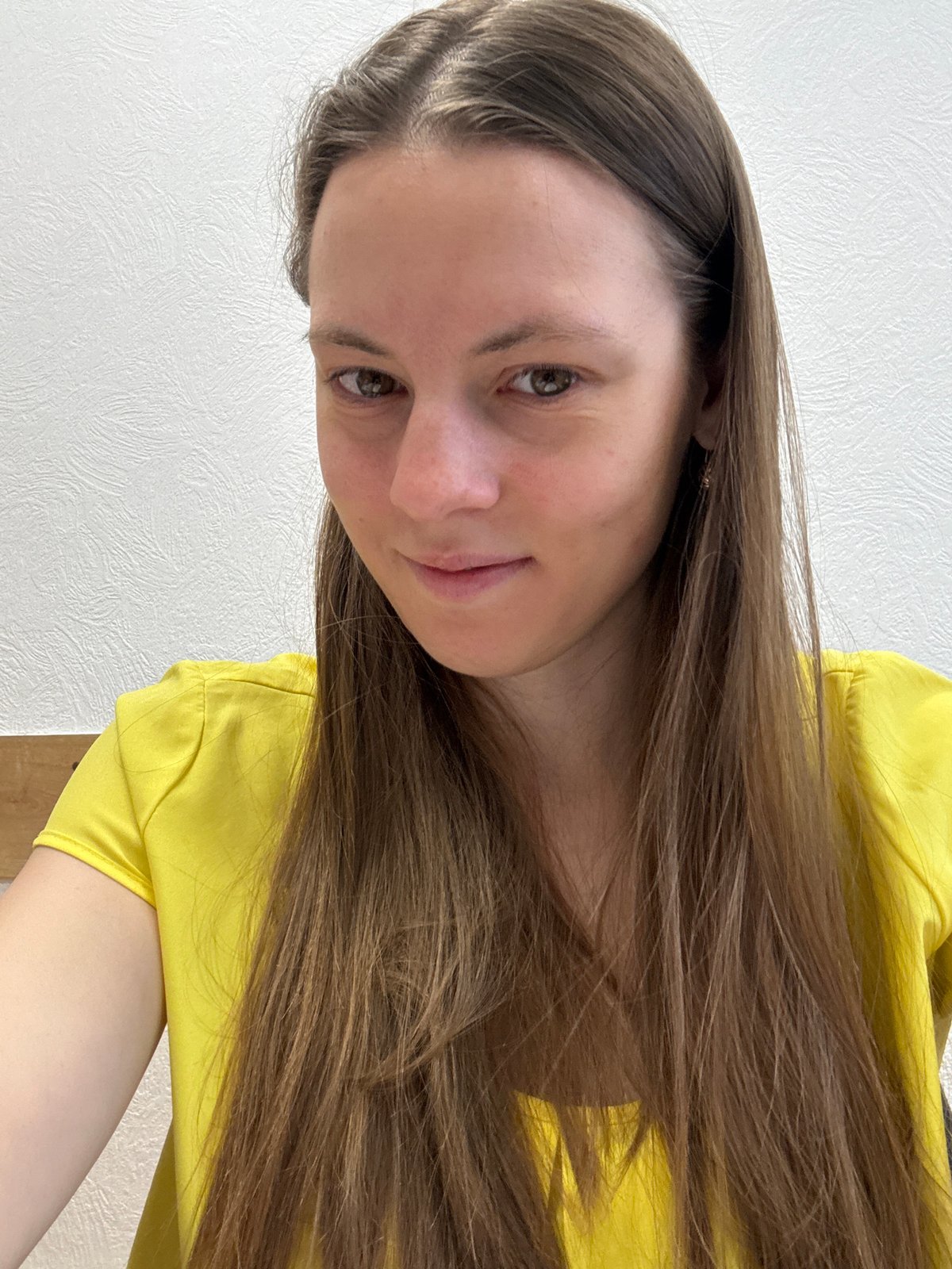 Woman photographed indoors in yellow top, Chaikovsky Russia