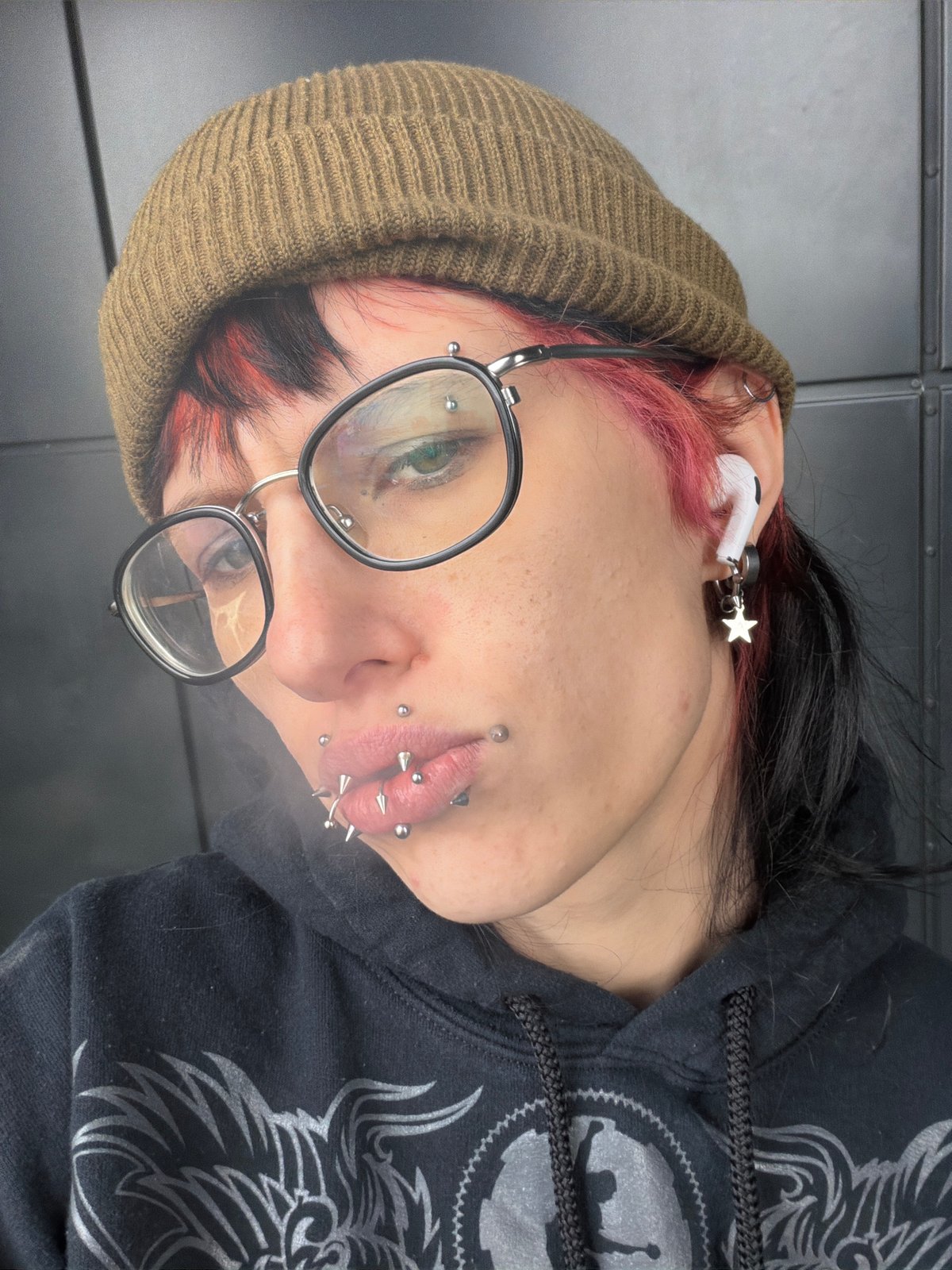 Portrait of heavily pierced individual captured in Sofia