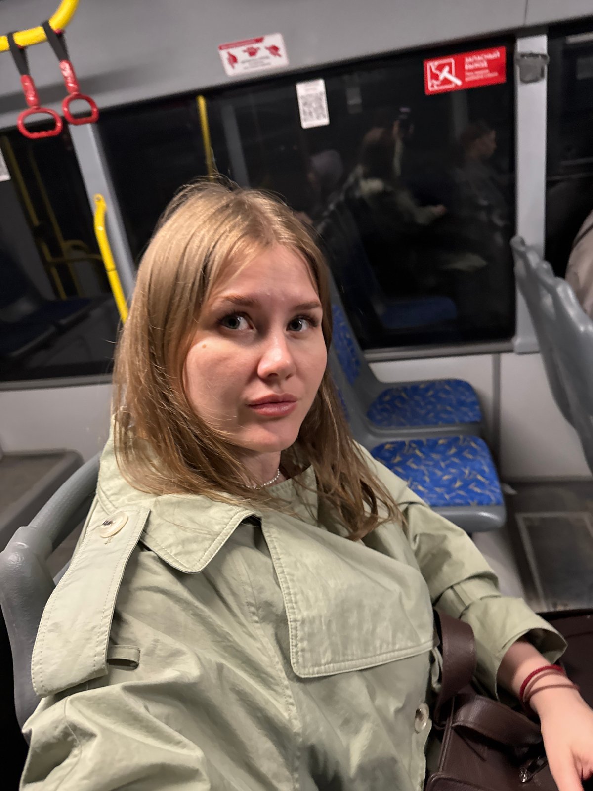 Woman rides passenger bus in Ferma, Russia