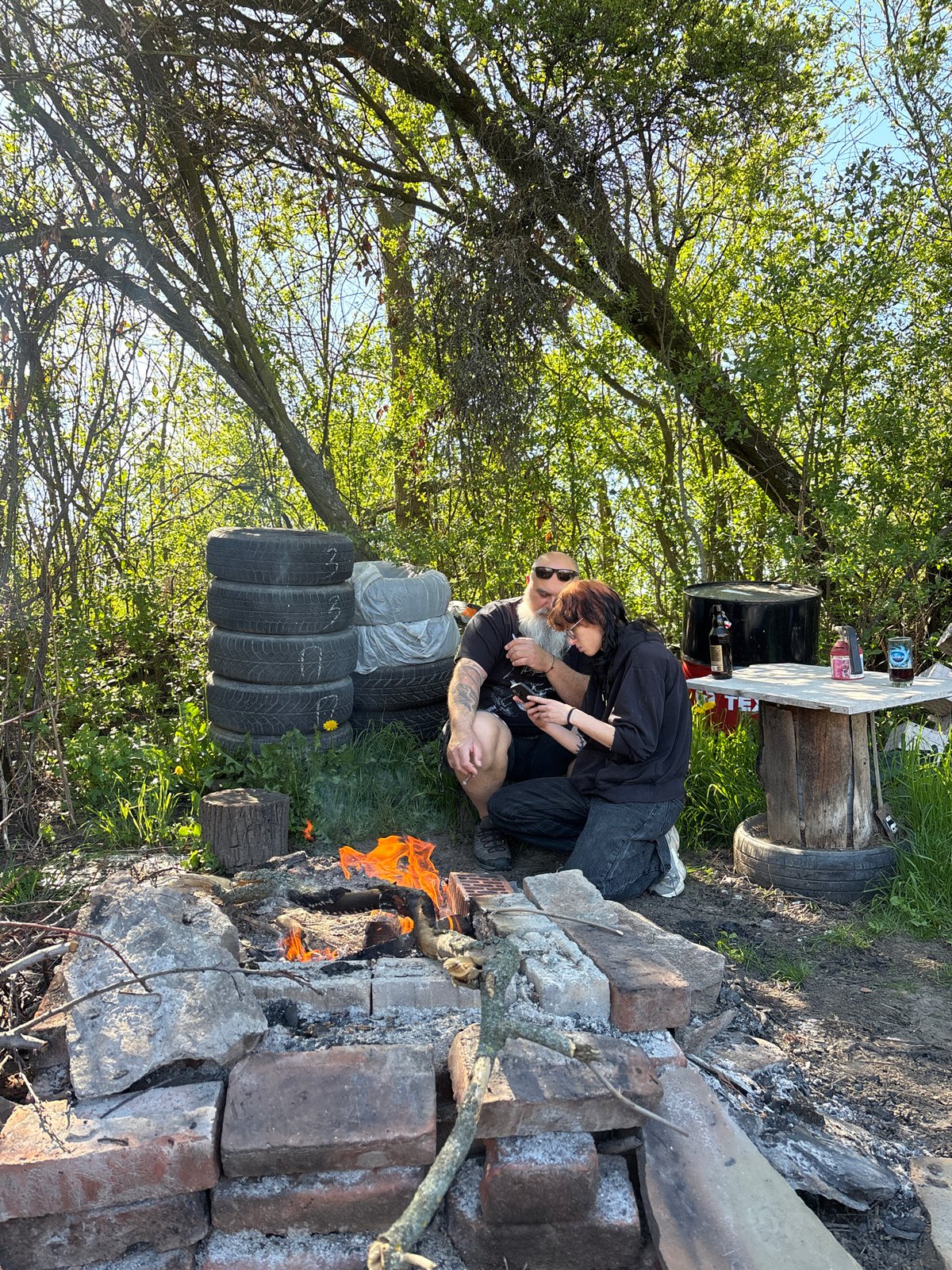 Casual camping gathering with campfire and drinks in Verinsko, Bulgaria