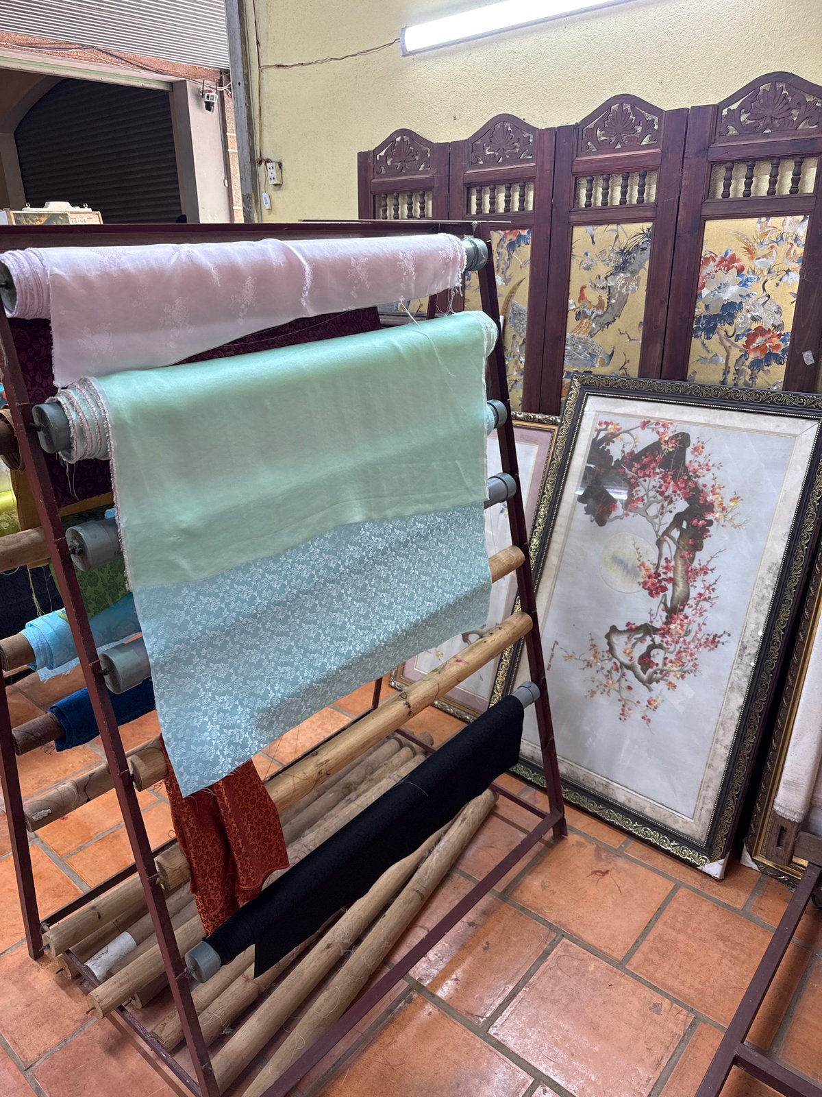 Textile workshop with traditional Vietnamese displays documented in Nam Ban