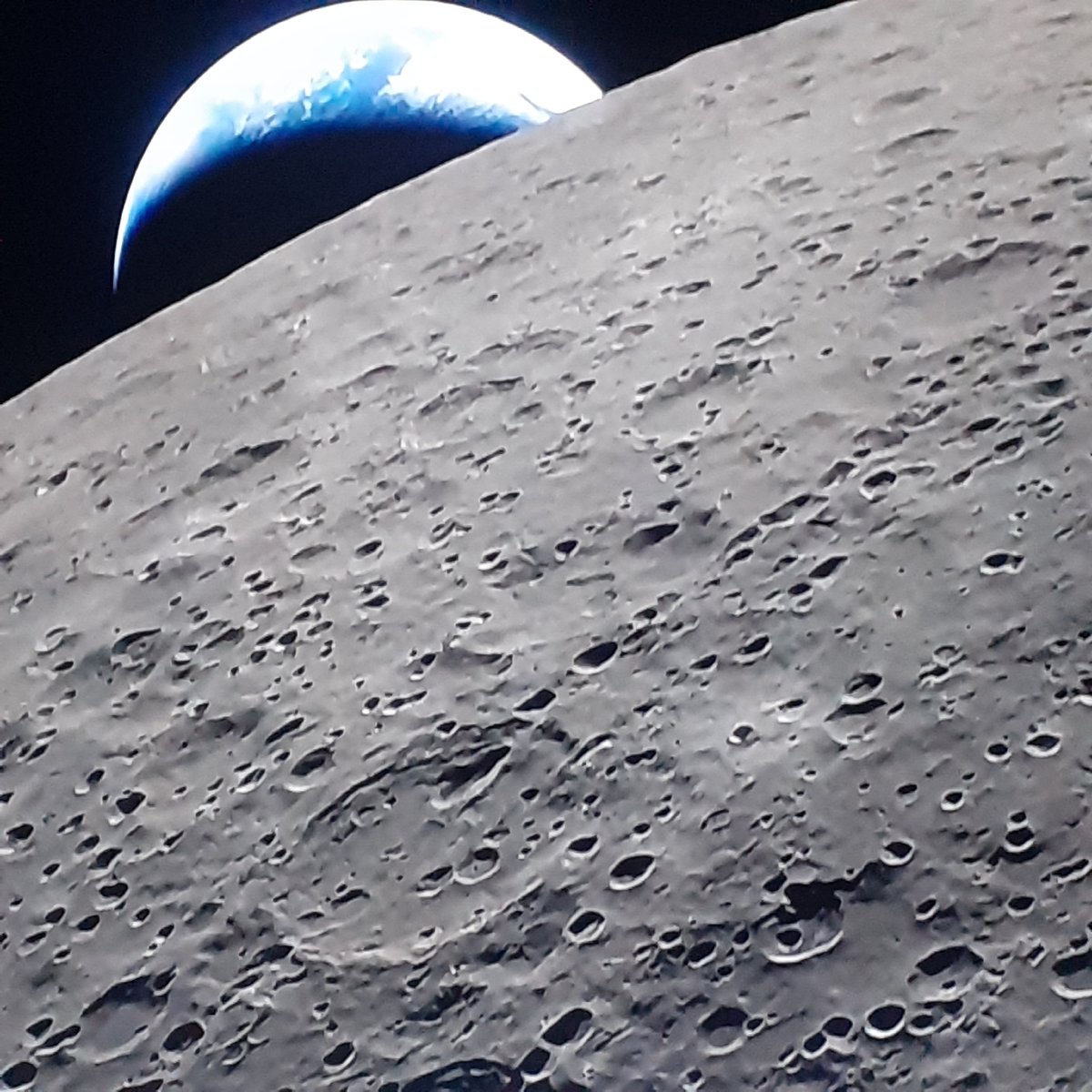 Sofia observer photographs moon surface with crescent Earth visible