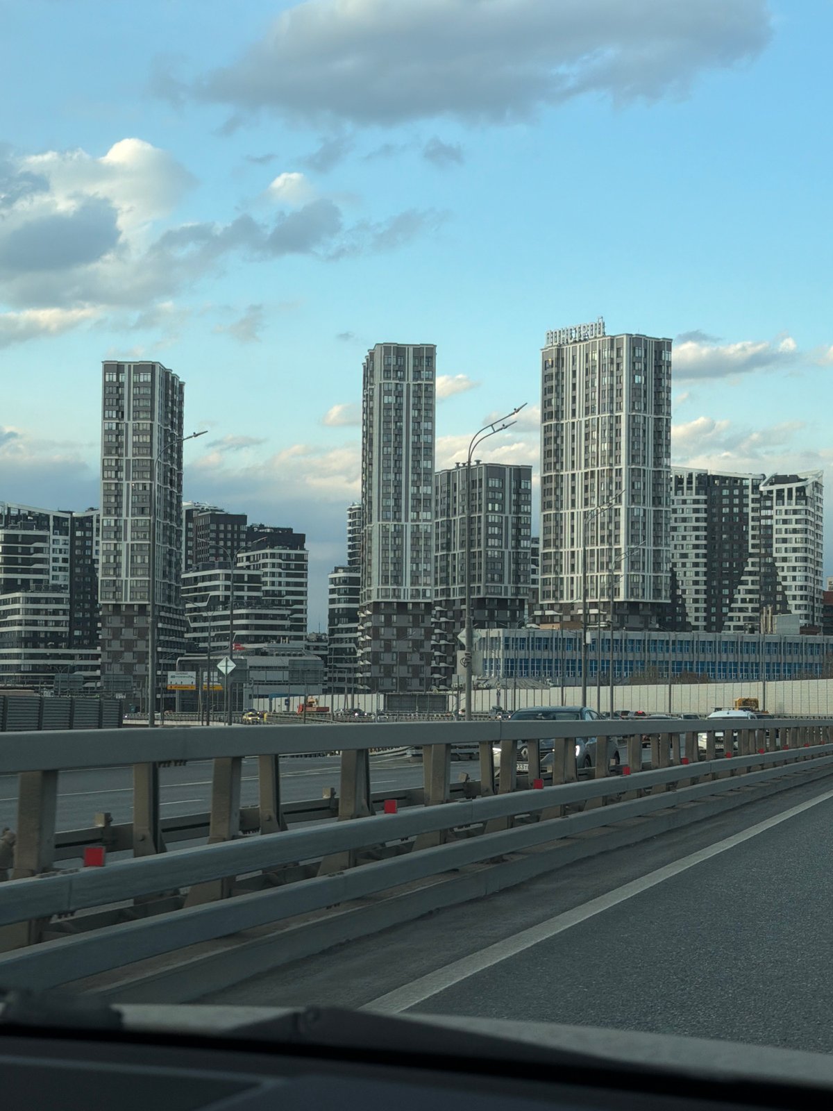 Moscow residential towers photographed under cloudy afternoon sky