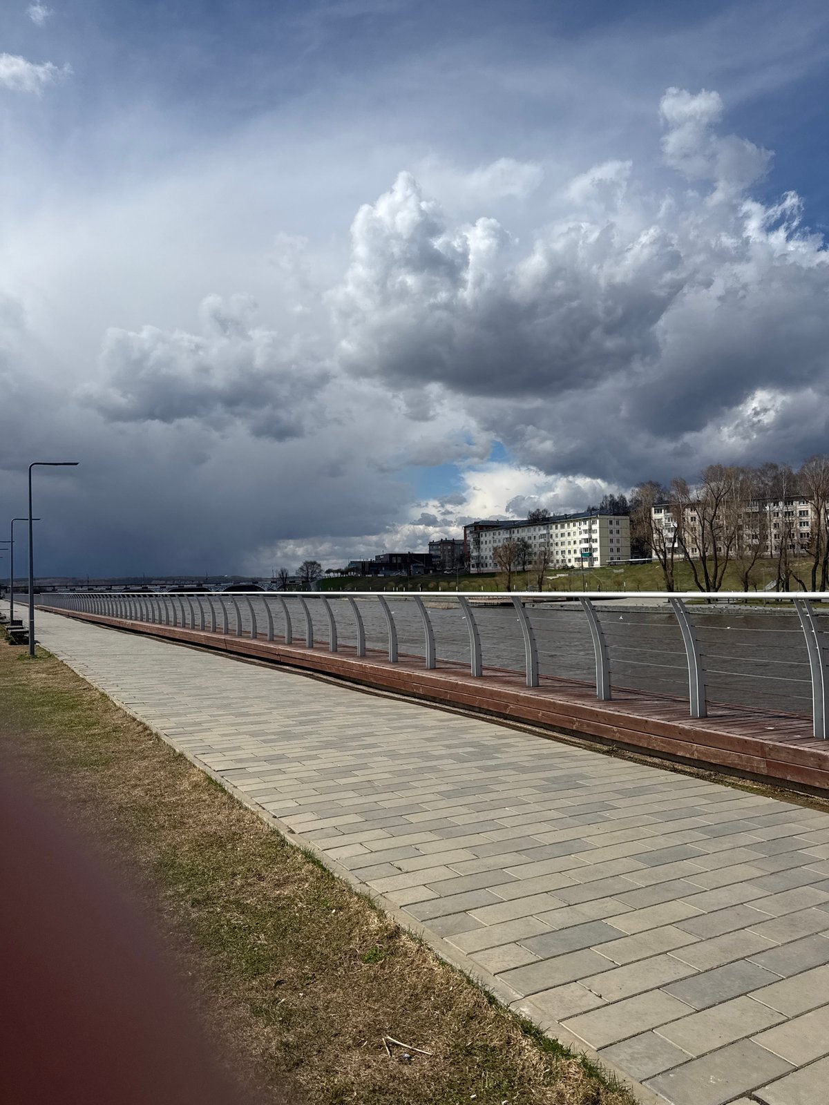 Morning waterfront walk documented in Votkinsk, Russia