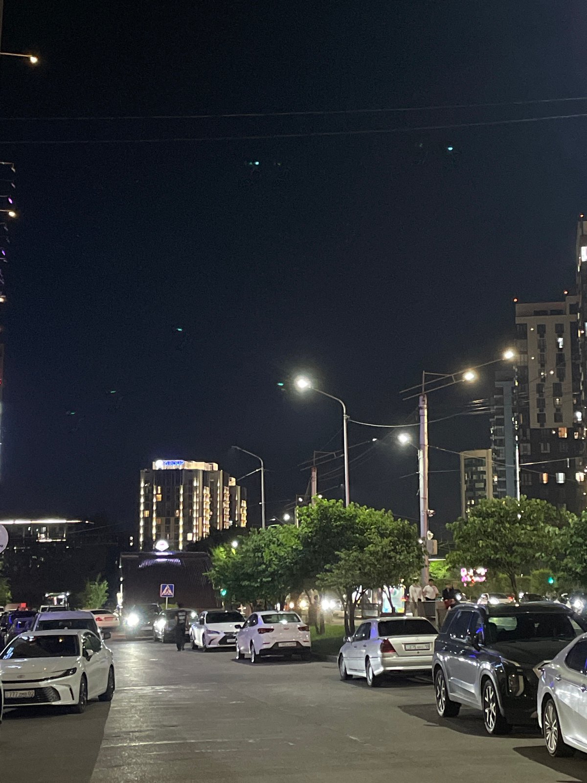 Almaty at night: busy streets, glowing towers, and city traffic