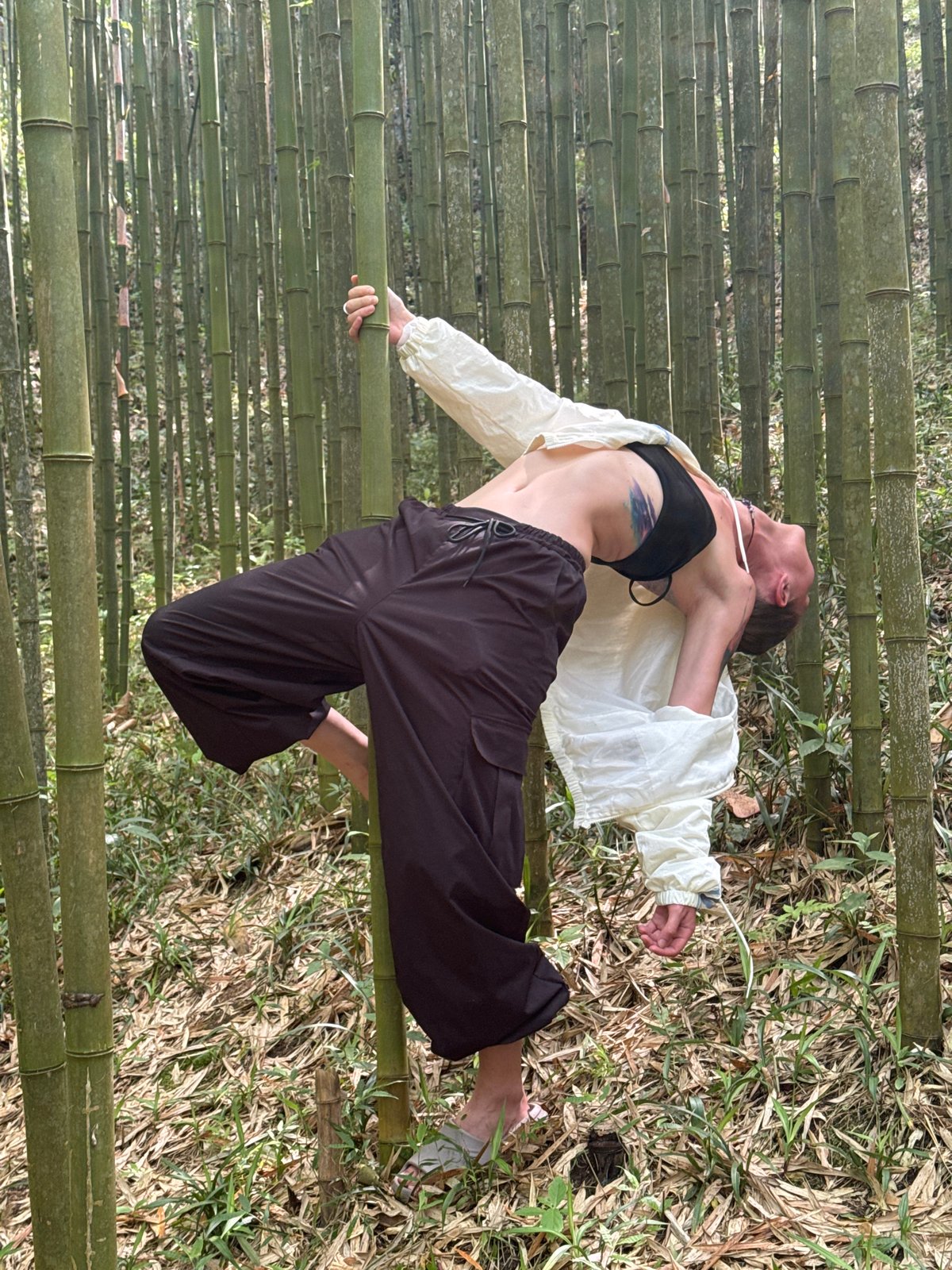 Woman photographs herself in Vietnamese bamboo forest with deer