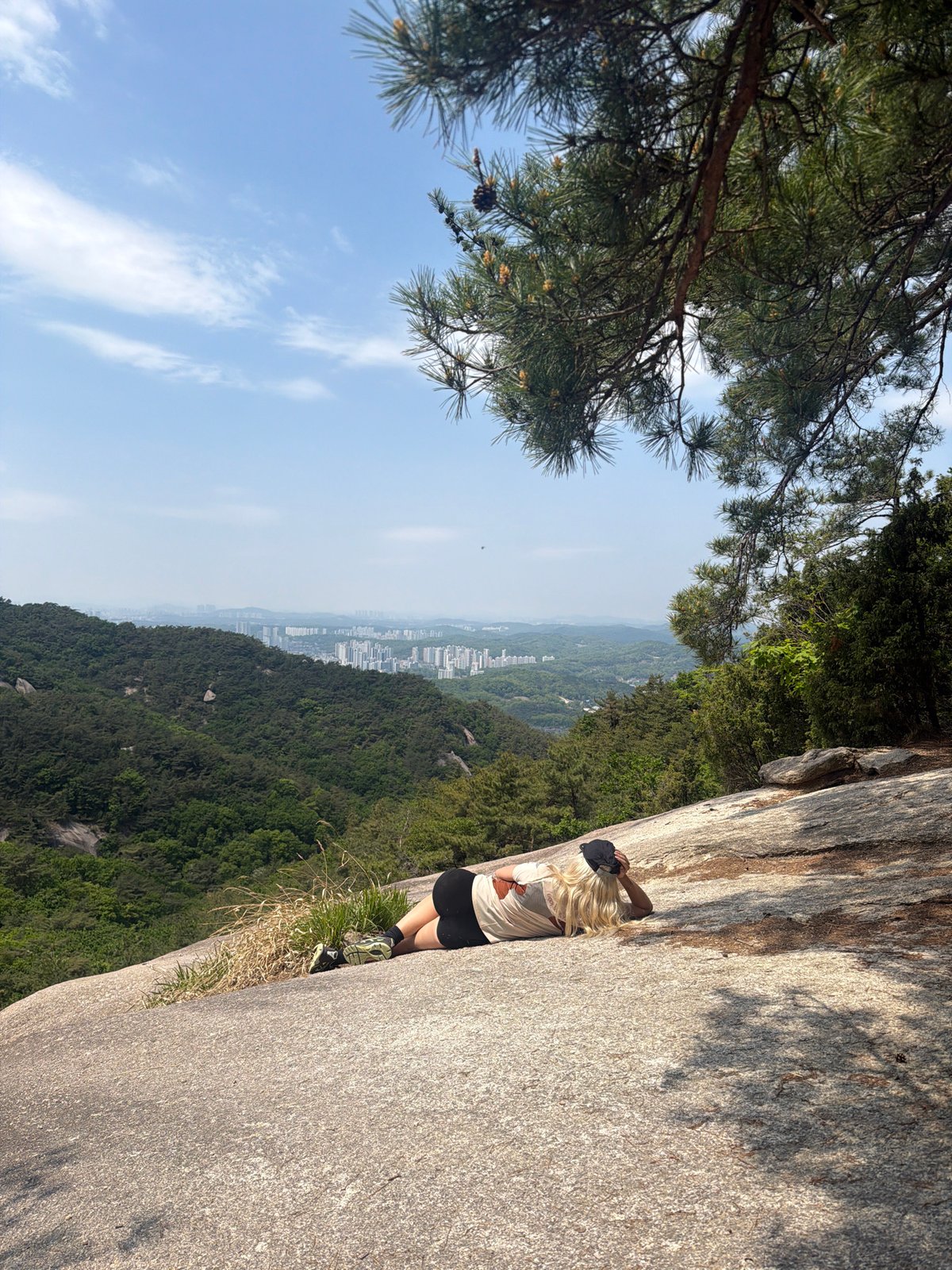 Woman stands on granite rocks at Seoul's Bukhansan National Park