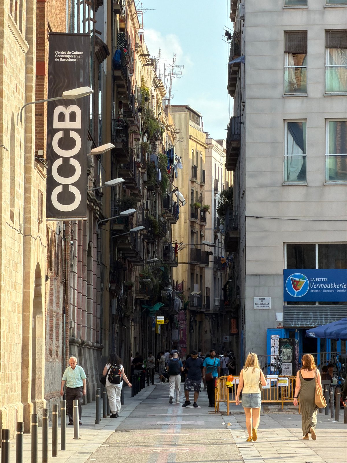 Clear sunny day observed on Barcelona street from elevated view