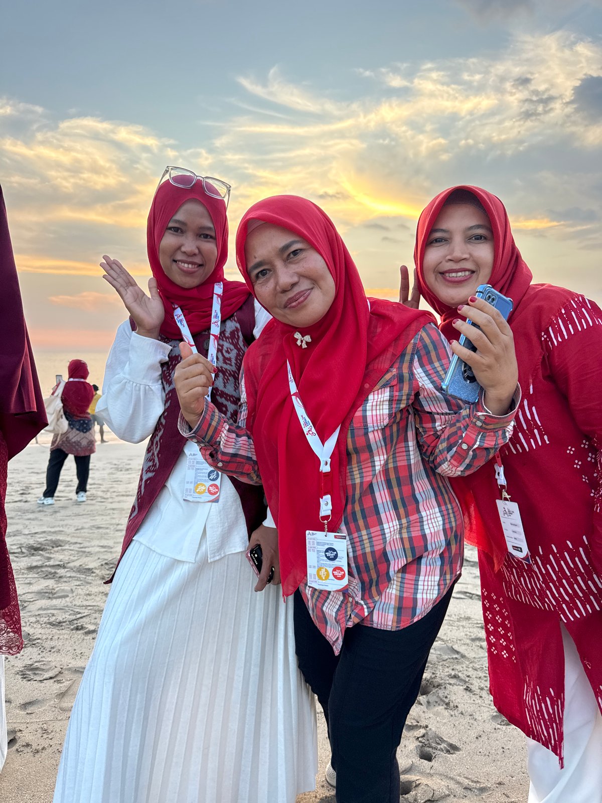 Sunset gathering captured at Kuta Beach with families and community