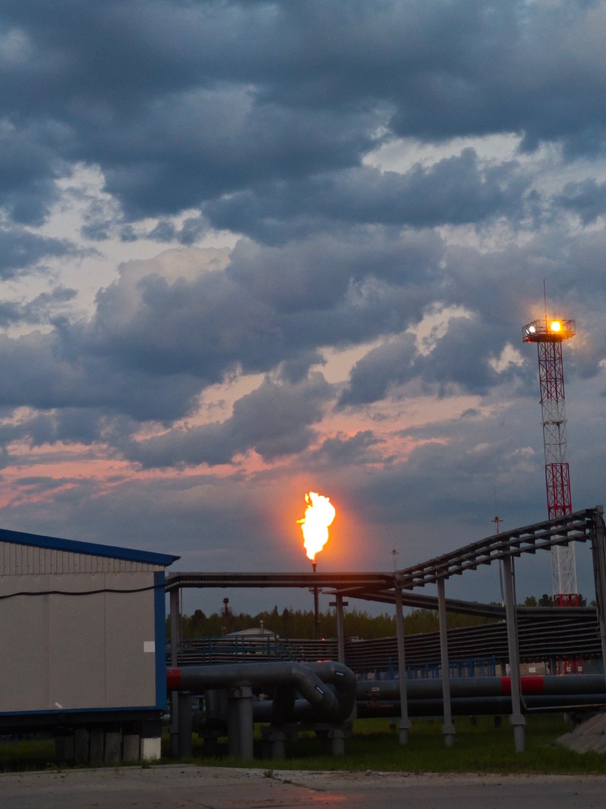 Individual documents twilight at industrial facility