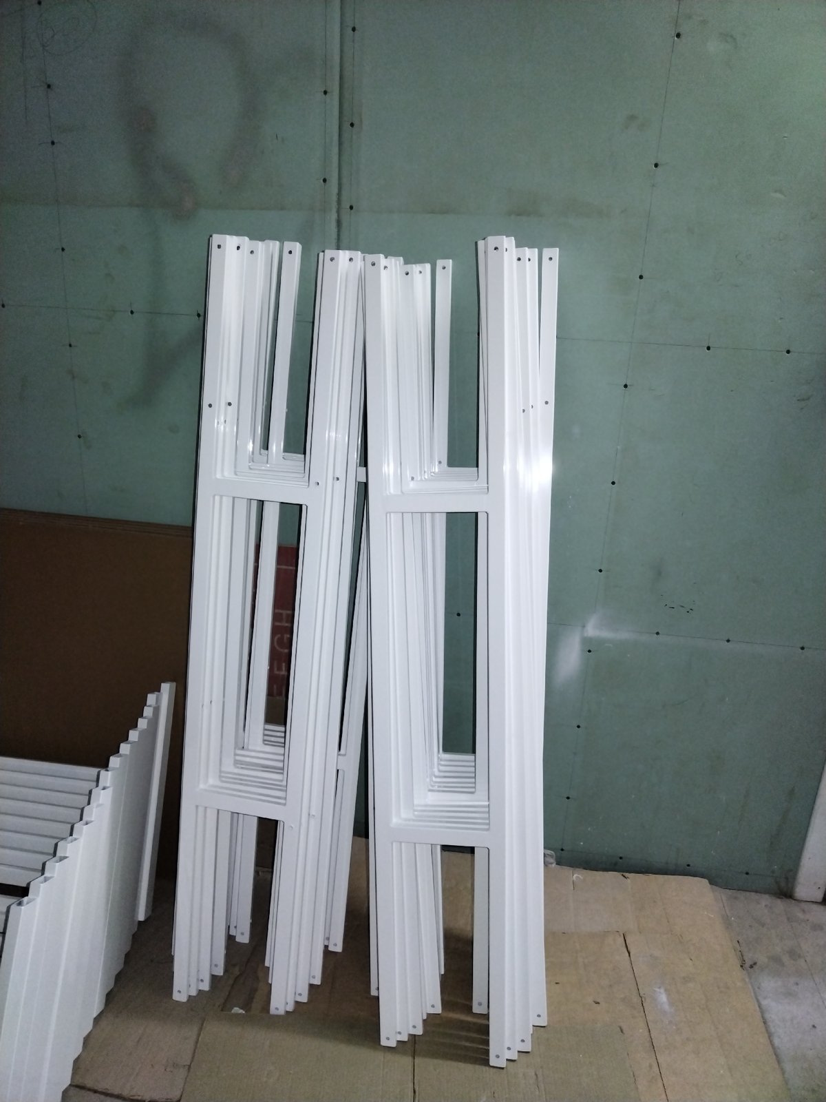 Window frames and labeled end caps in a Pargolovo construction storage area