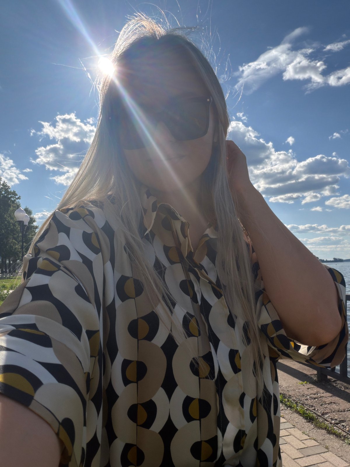 Woman takes sunny day selfies in Votkinsk, Russia