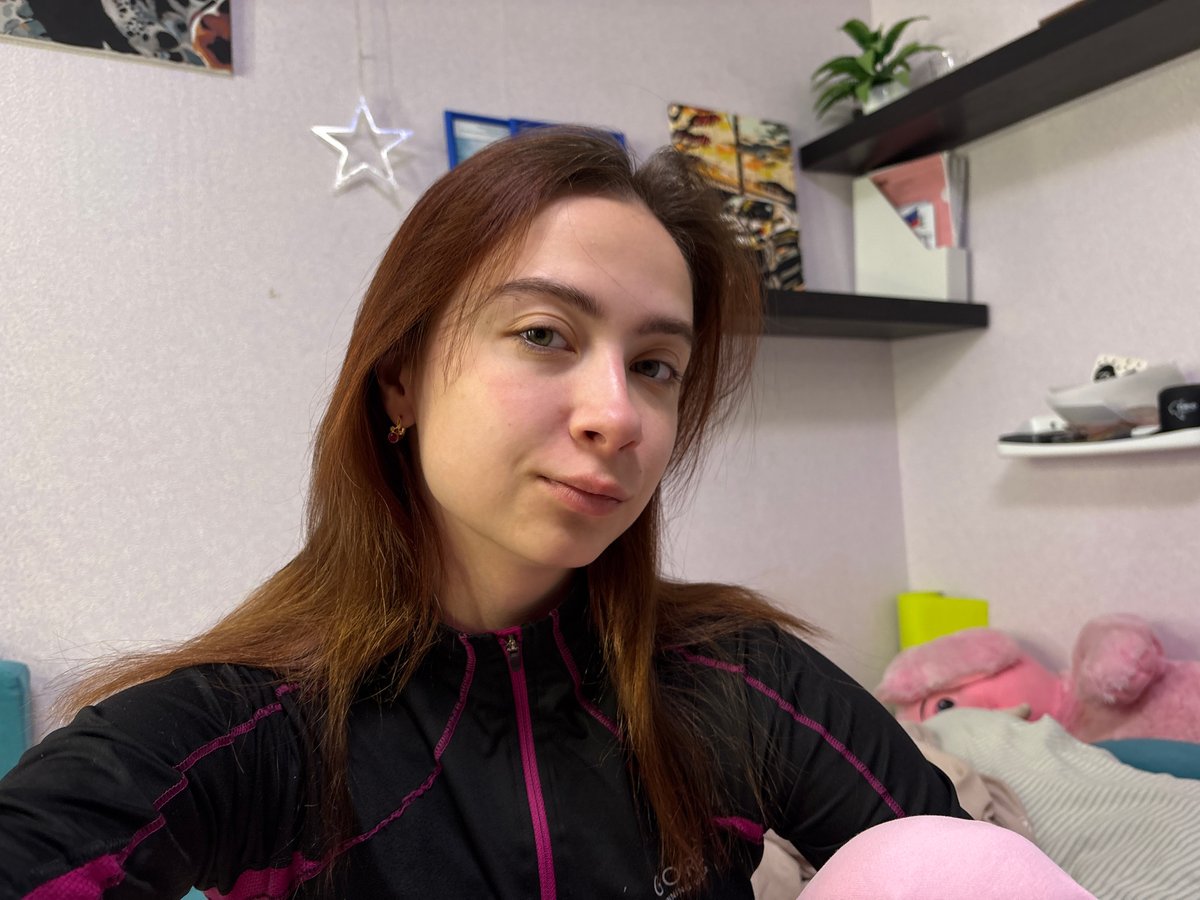 Woman documents personal moments in early morning selfie session
