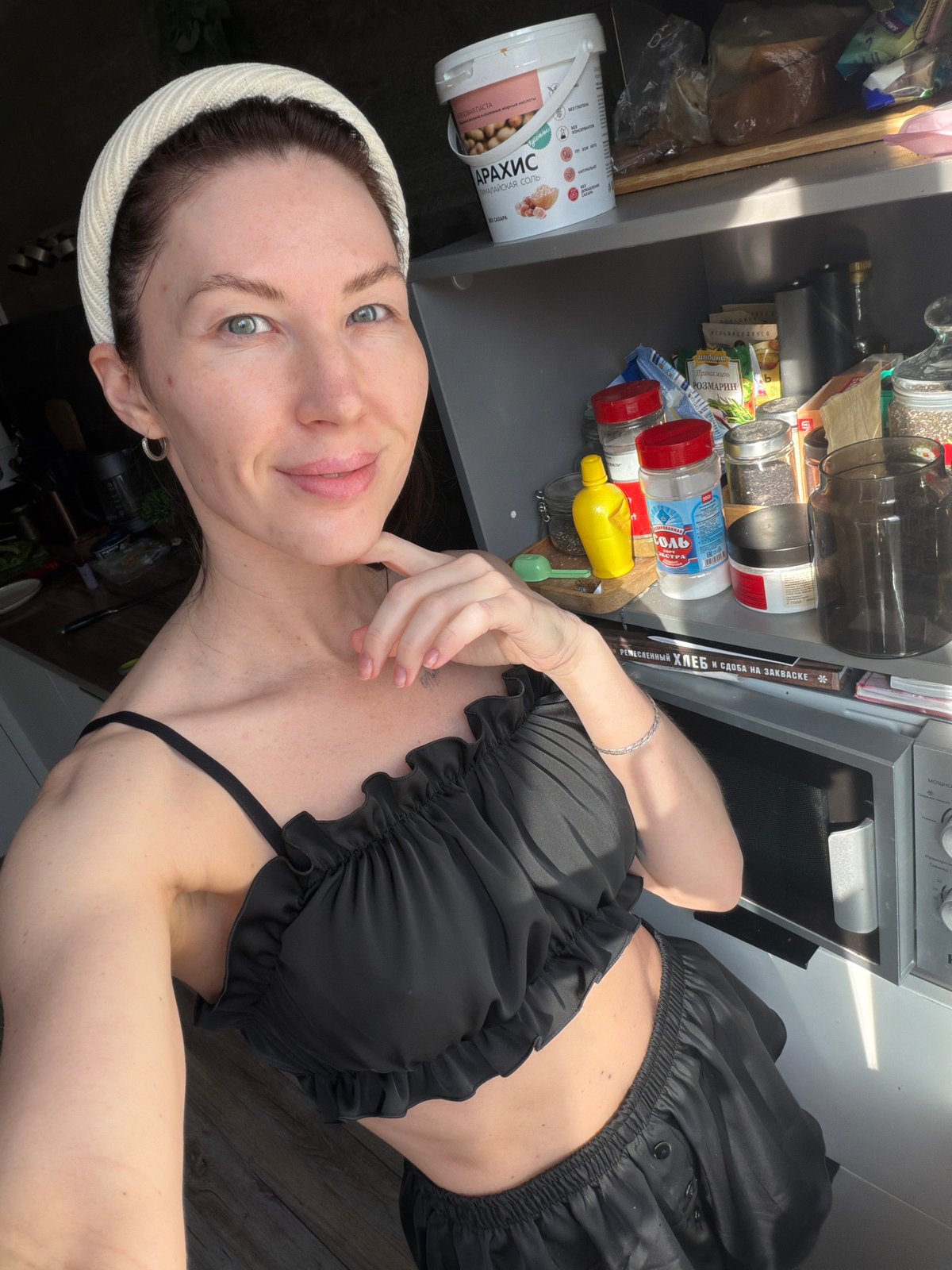 Woman takes early morning kitchen selfie in Perm